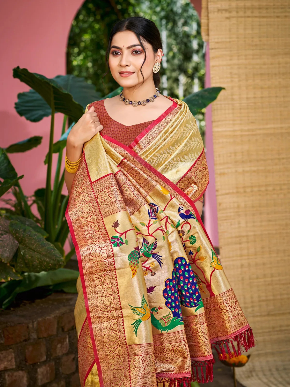 Tarani golden Kanjivaram silk saree pallu view featuring peacock and floral design