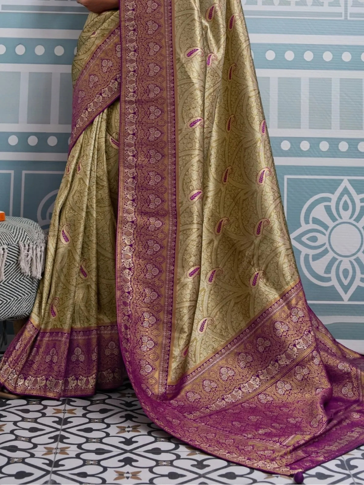 Tarani golden silk saree pallu view showing broad zari border and intricate weaving