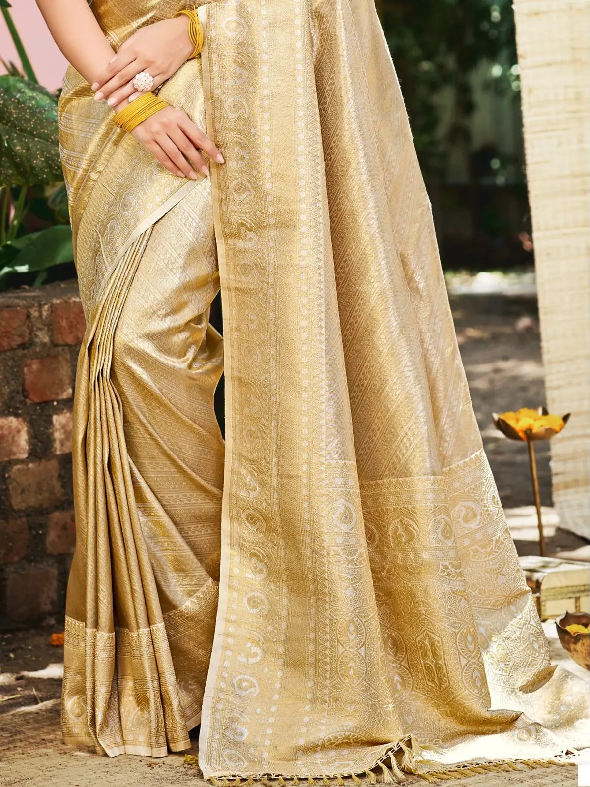 Tarani golden Kanjivaram silk saree pallu view with intricate border and woven design