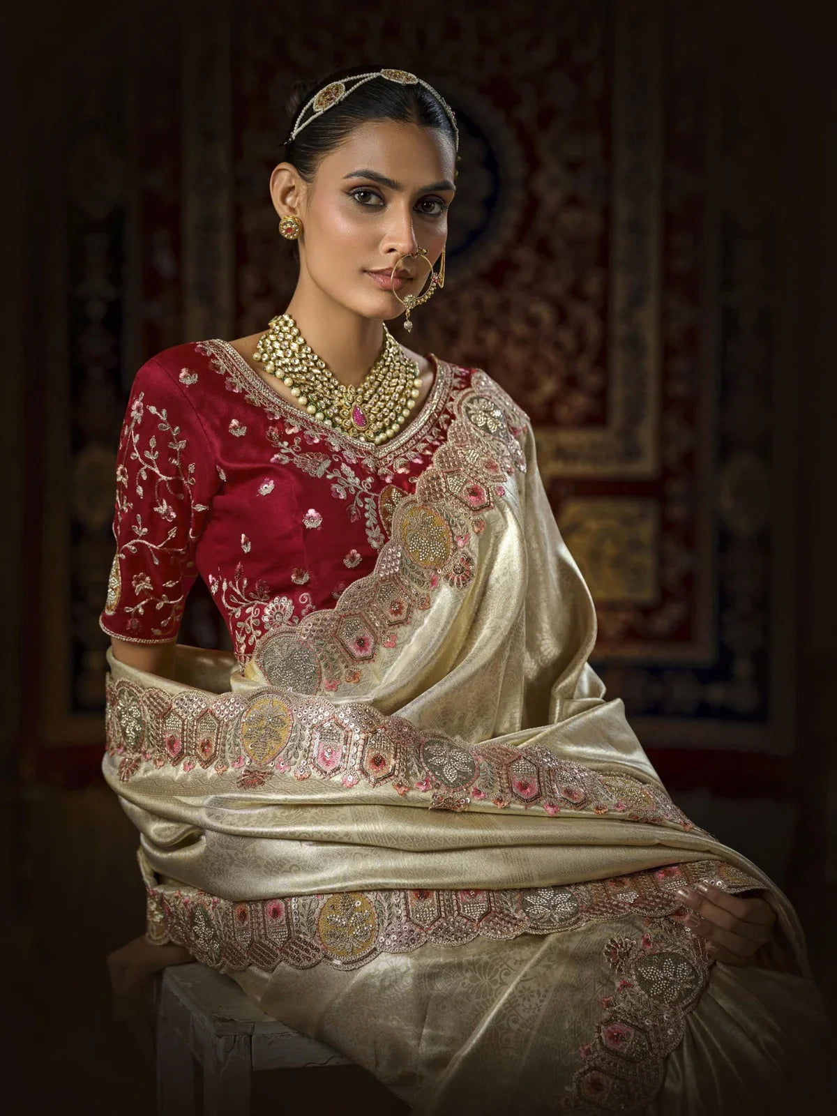 Tarani golden silk bridal saree upper body view showing detailed maroon blouse and jewelry