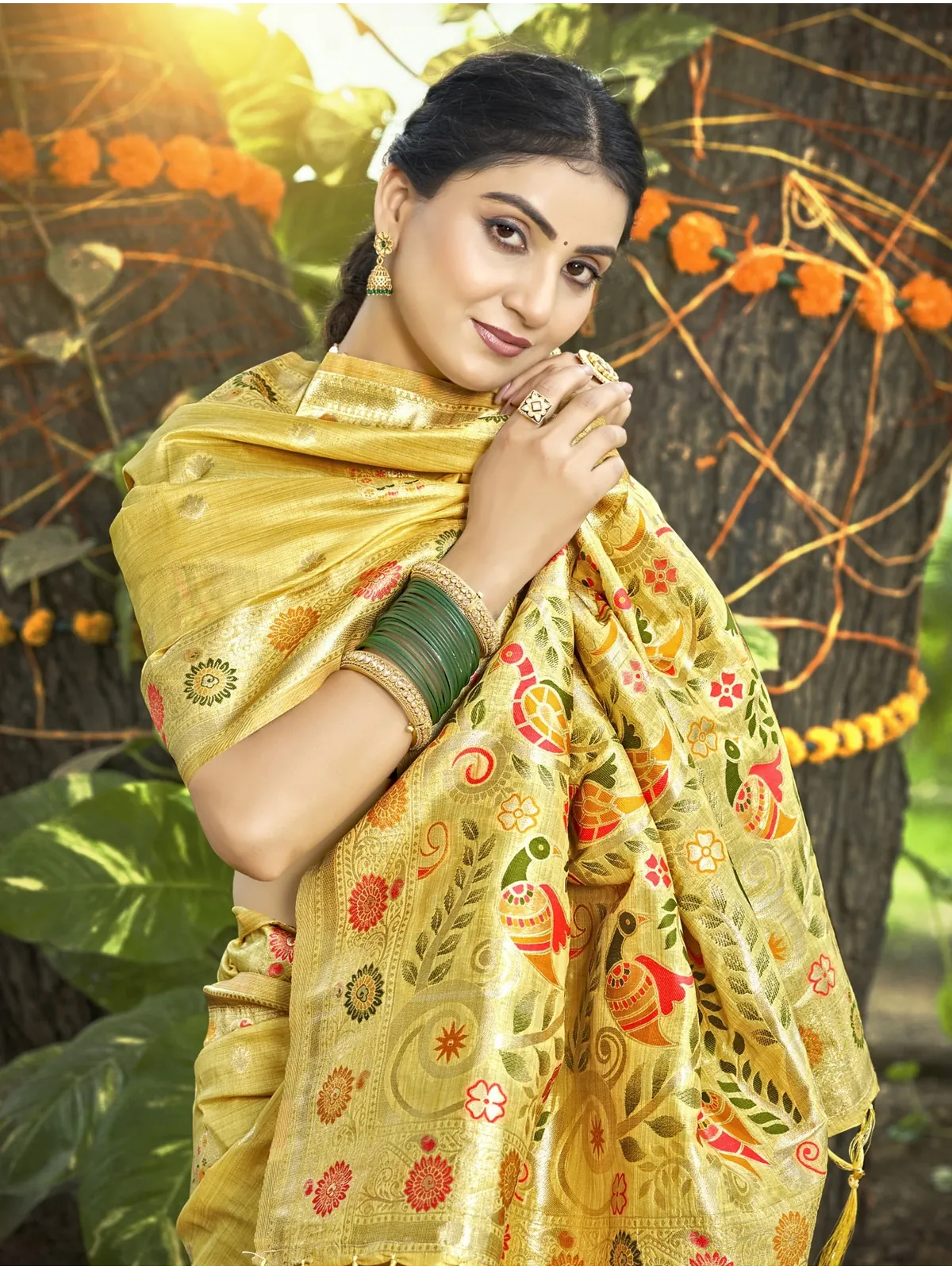 Tarani golden Kanan silk saree upper body view showing blouse sleeve detail and refined zari texture