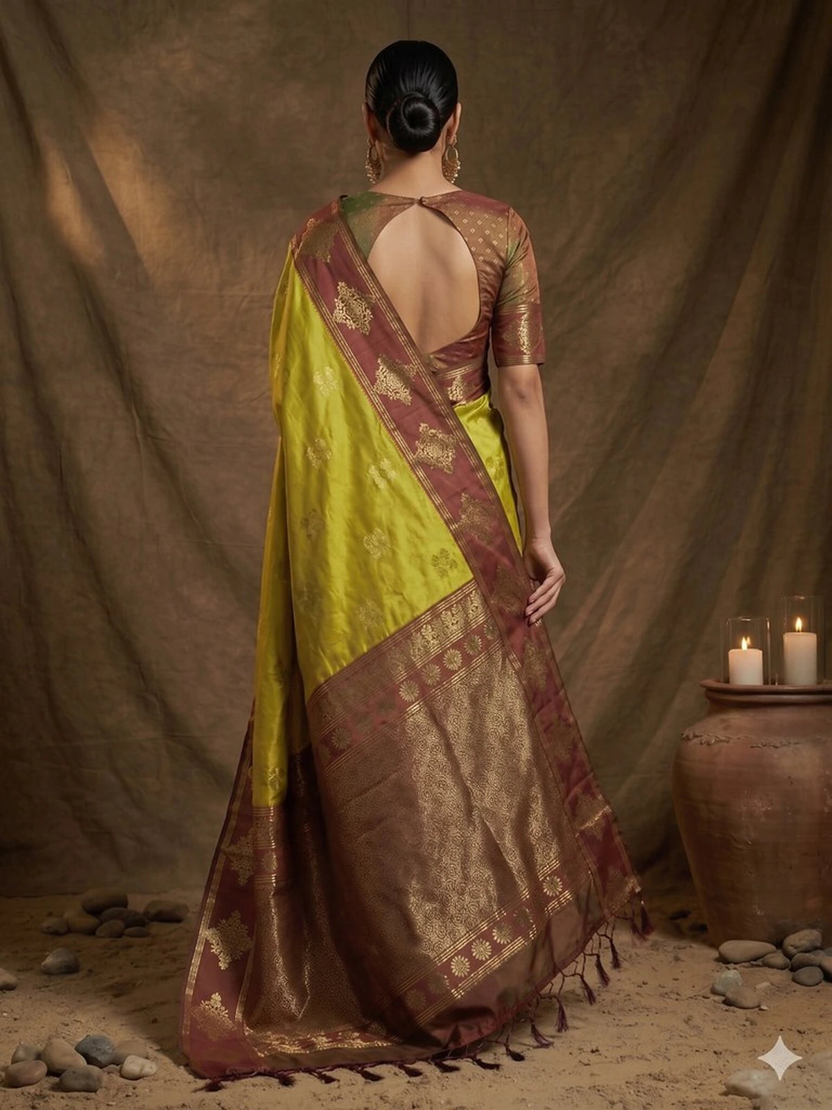 Tarani green silk saree back view featuring zari woven pallu and stylish blouse pattern