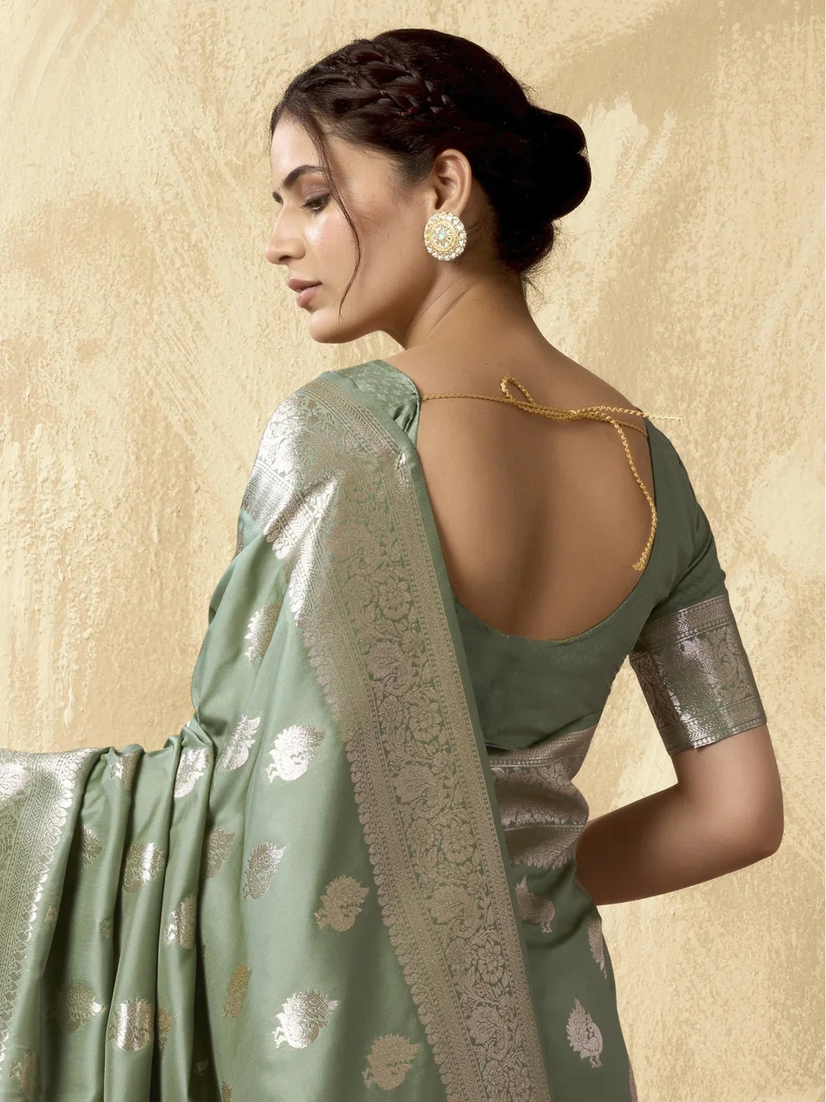 Tarani green silk saree with blouse and zari border back view