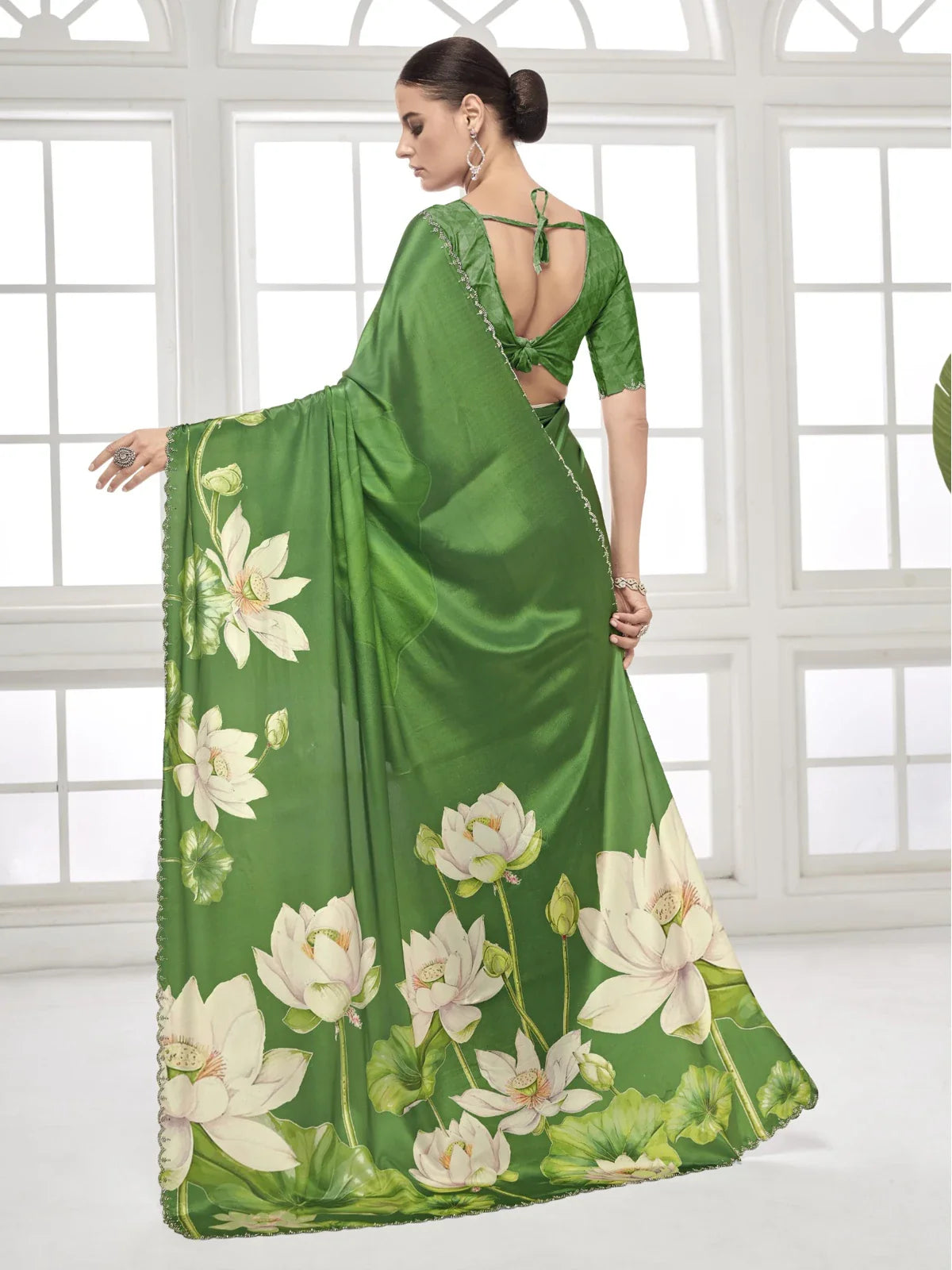 Tarani full back view of green lotus printed saree with deep neck blouse and tie-up detail