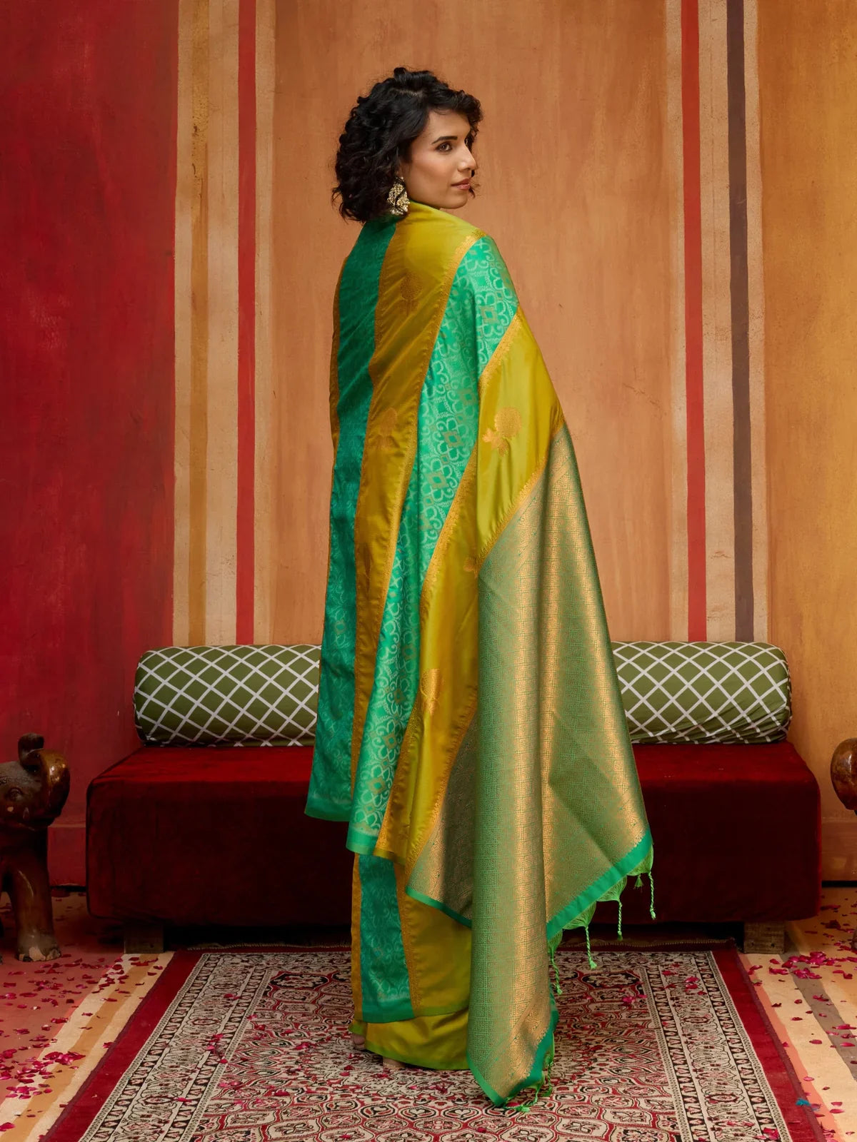 Tarani green silk saree back model view with elegant drape and contrast detailing