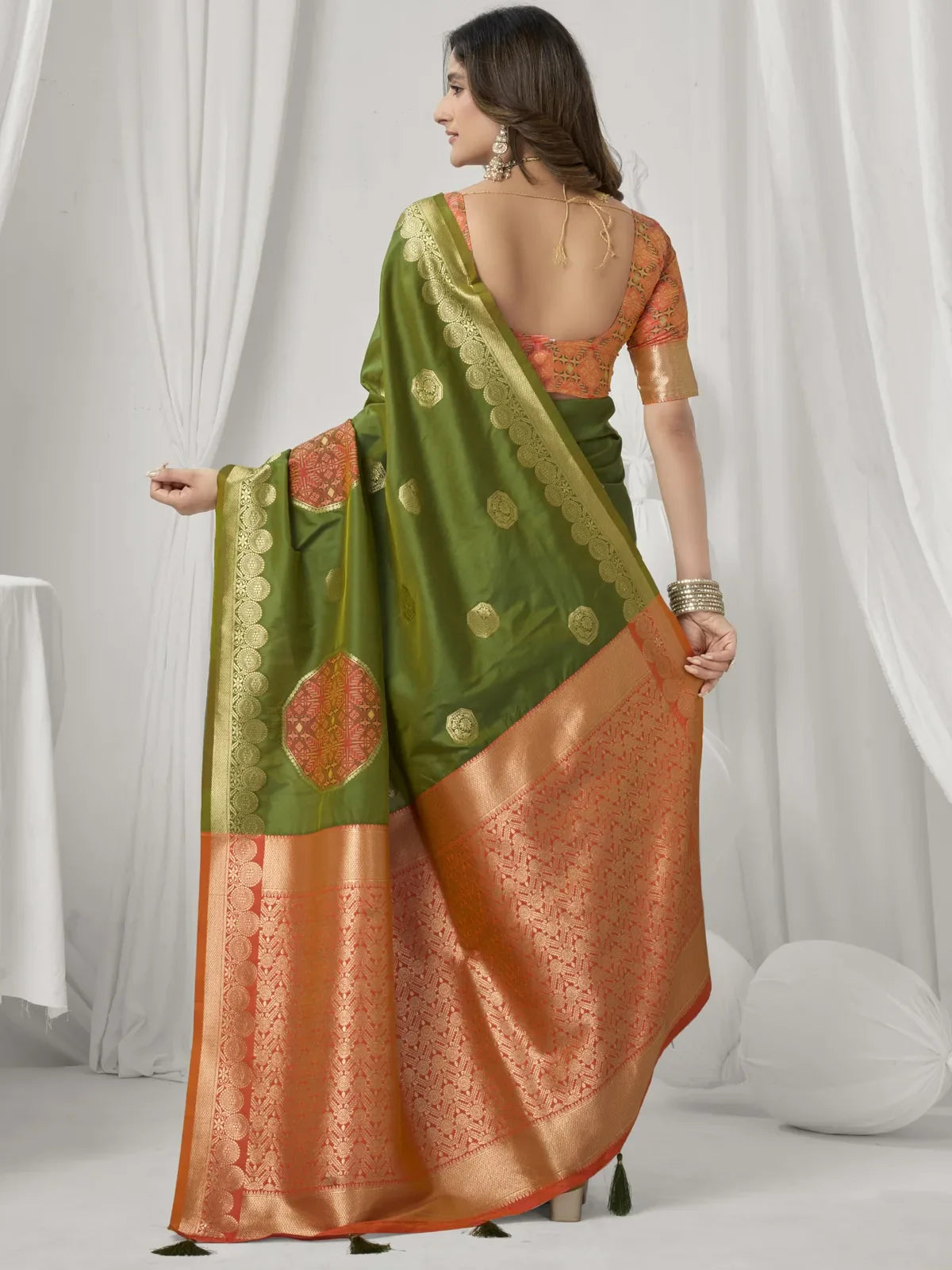 Tarani green silk saree back view showing full drape and border finish