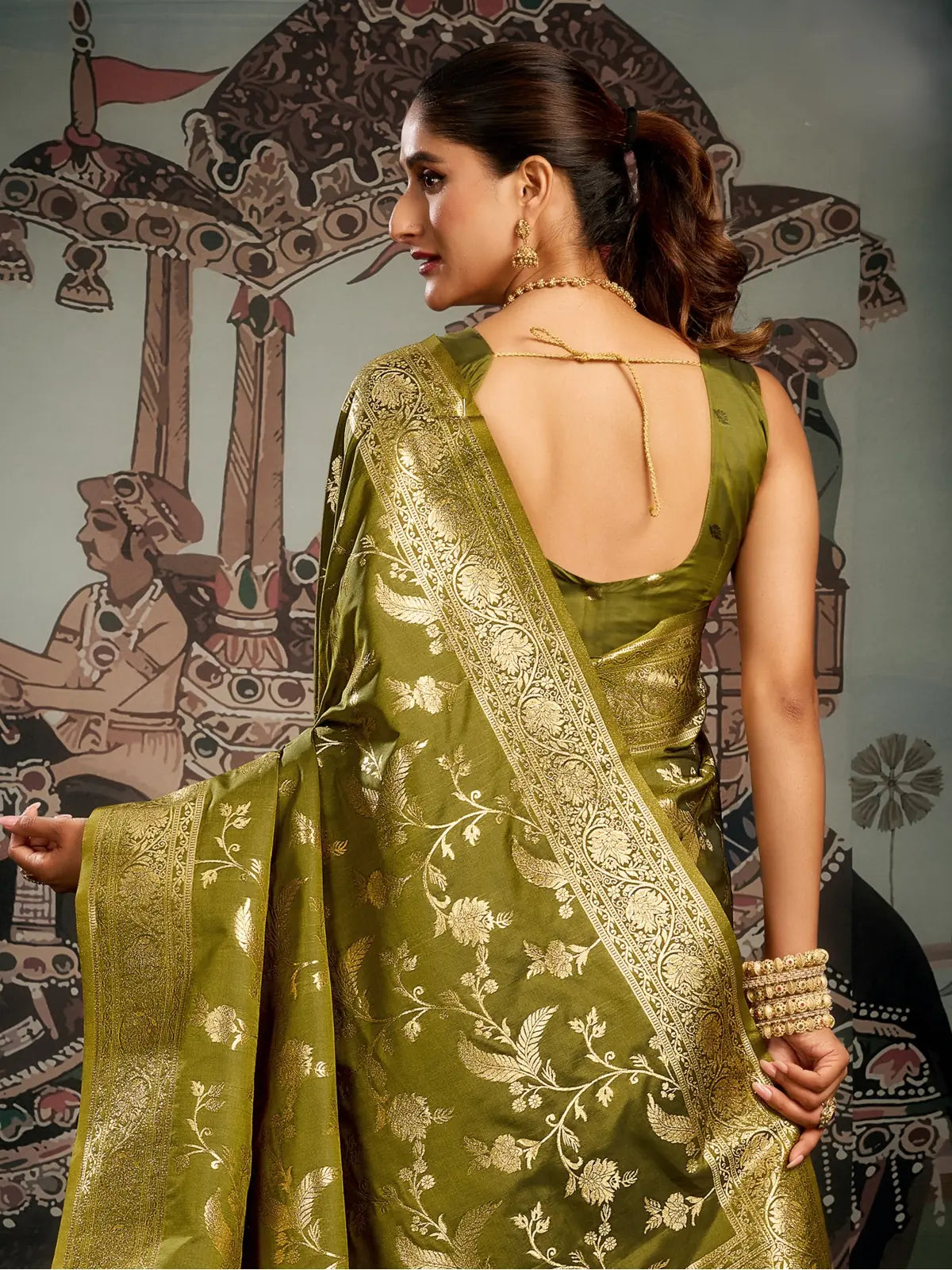 Tarani green silk saree back view with zari detailing