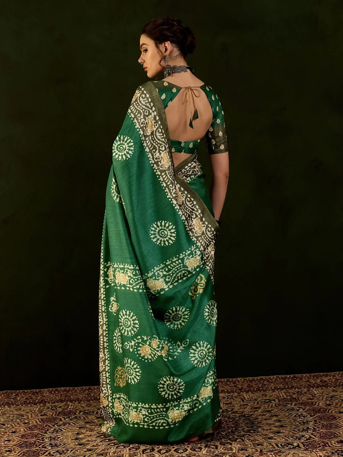 Tarani festive green Dola silk saree back view showing pallu and blouse design