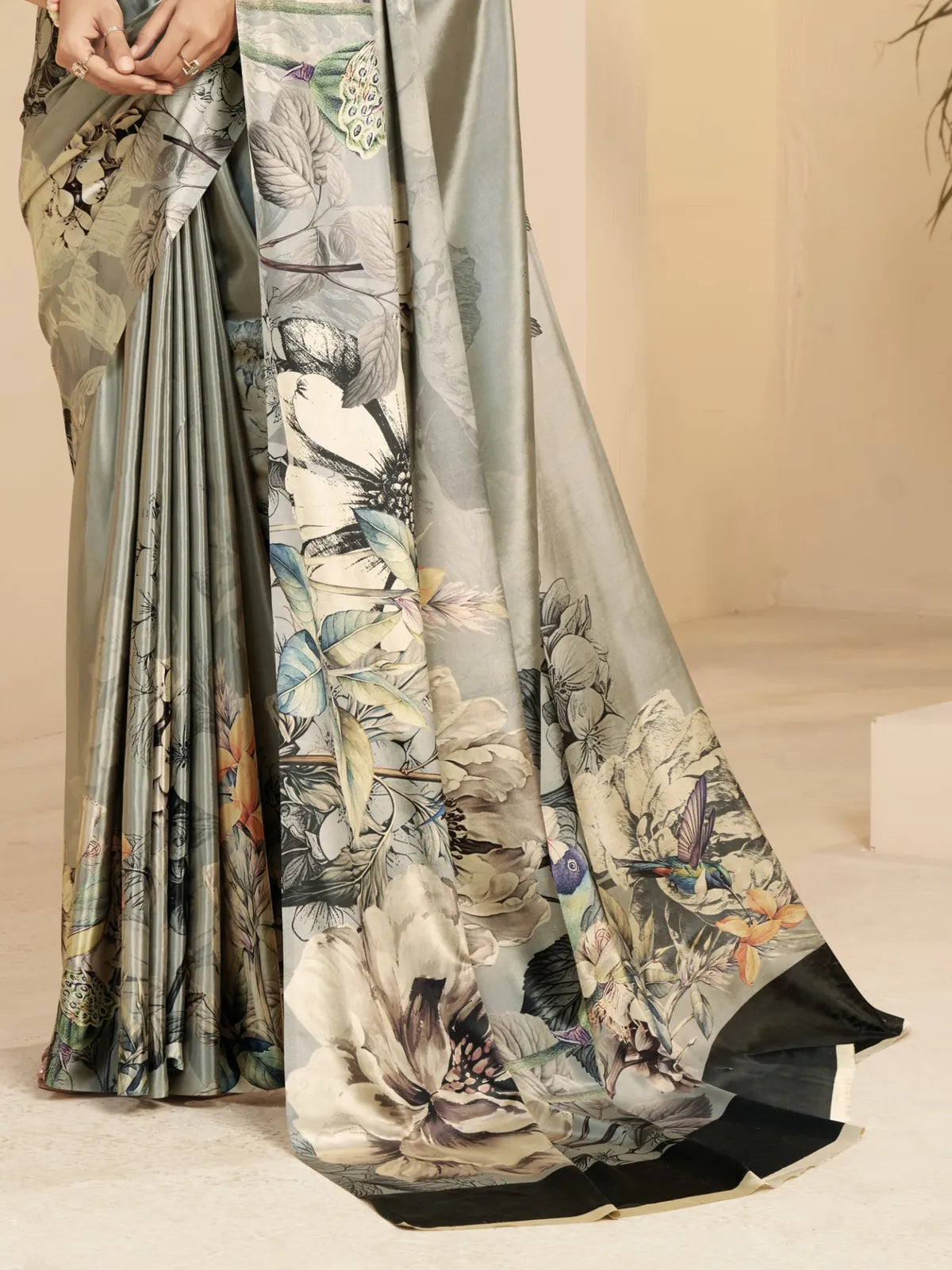 Tarani green saree back view showing pallu print and open blouse back design