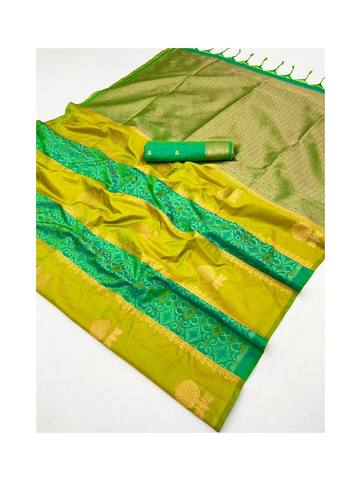 Tarani green silk saree fabric texture closeup showing pallu border and woven motifs