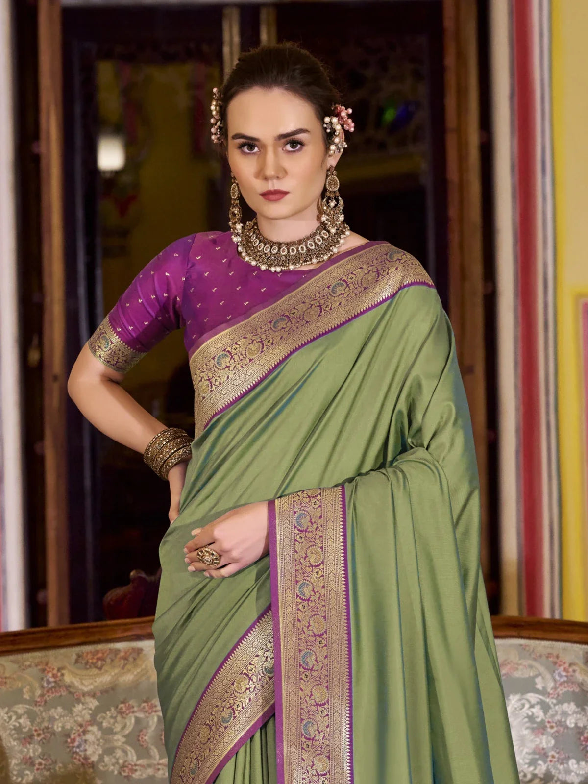 Tarani green silk saree front view with purple contrast border and blouse