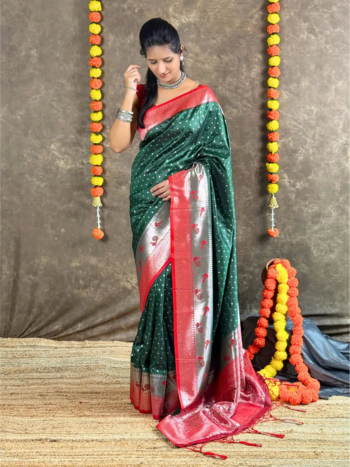 Tarani green silk saree full view with red and silver zari border for festive wear