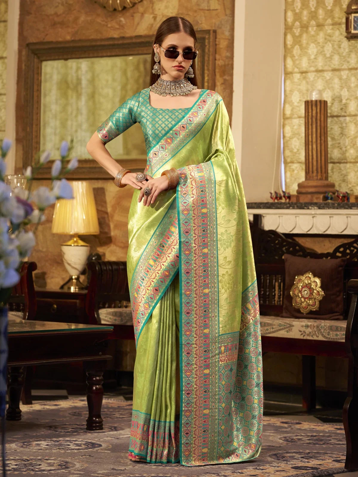 Tarani premium green tissue silk saree full view with woven border and contrast blouse
