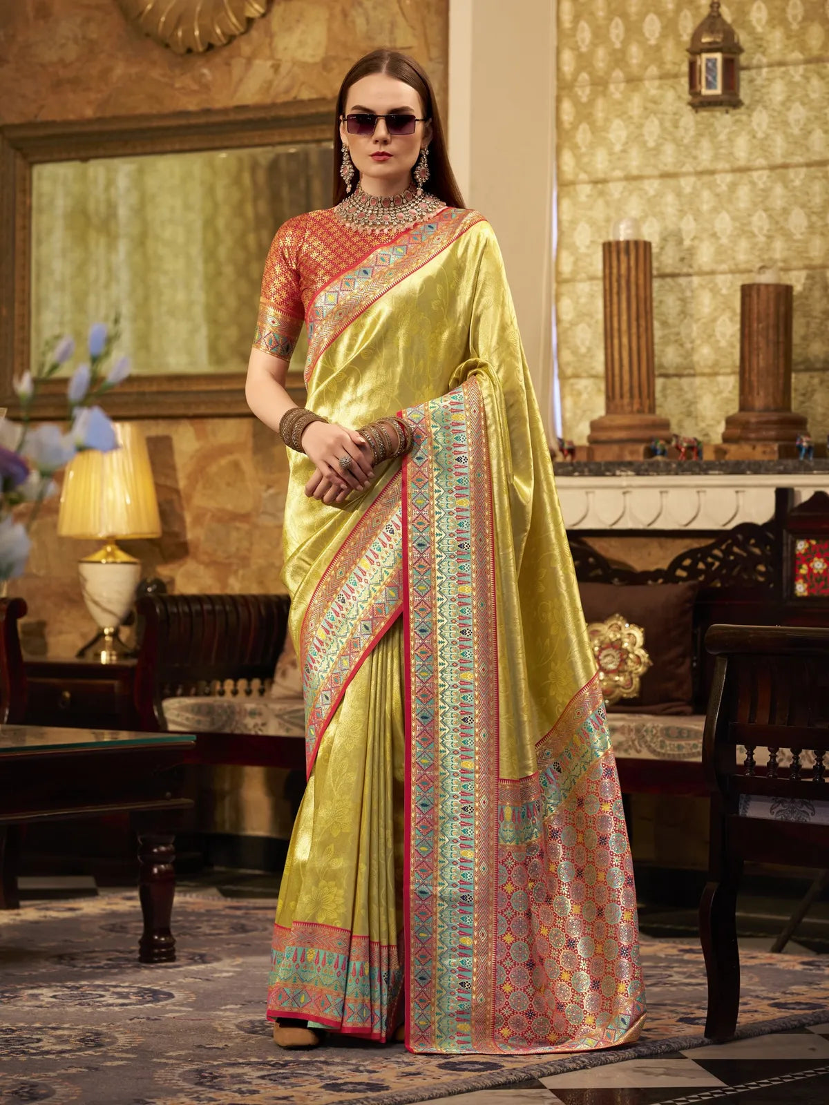 Tarani premium green tissue silk saree with designer border and contrast blouse for party and festive wear