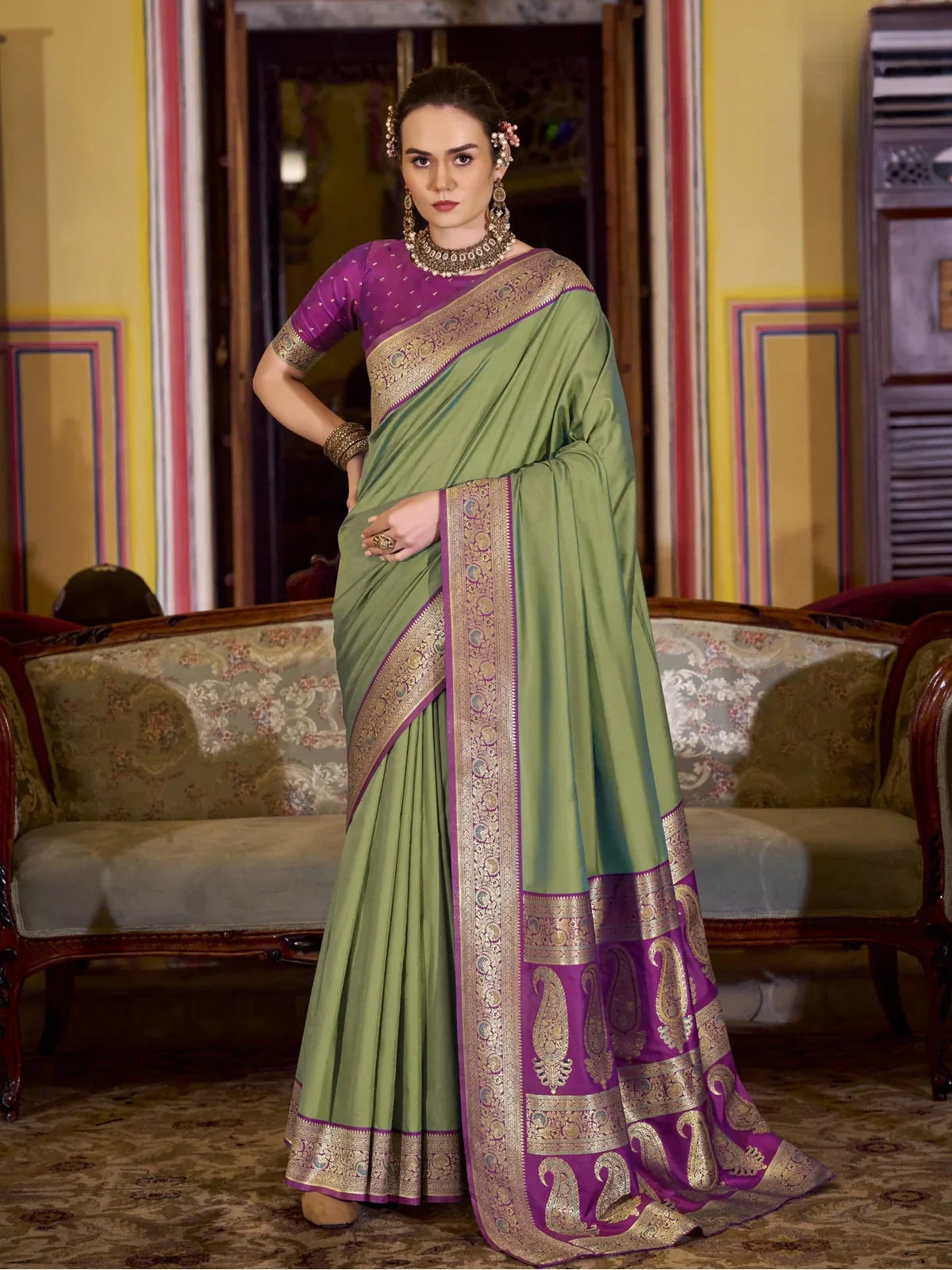 Tarani green silk saree full view with purple border and blouse for festive wear