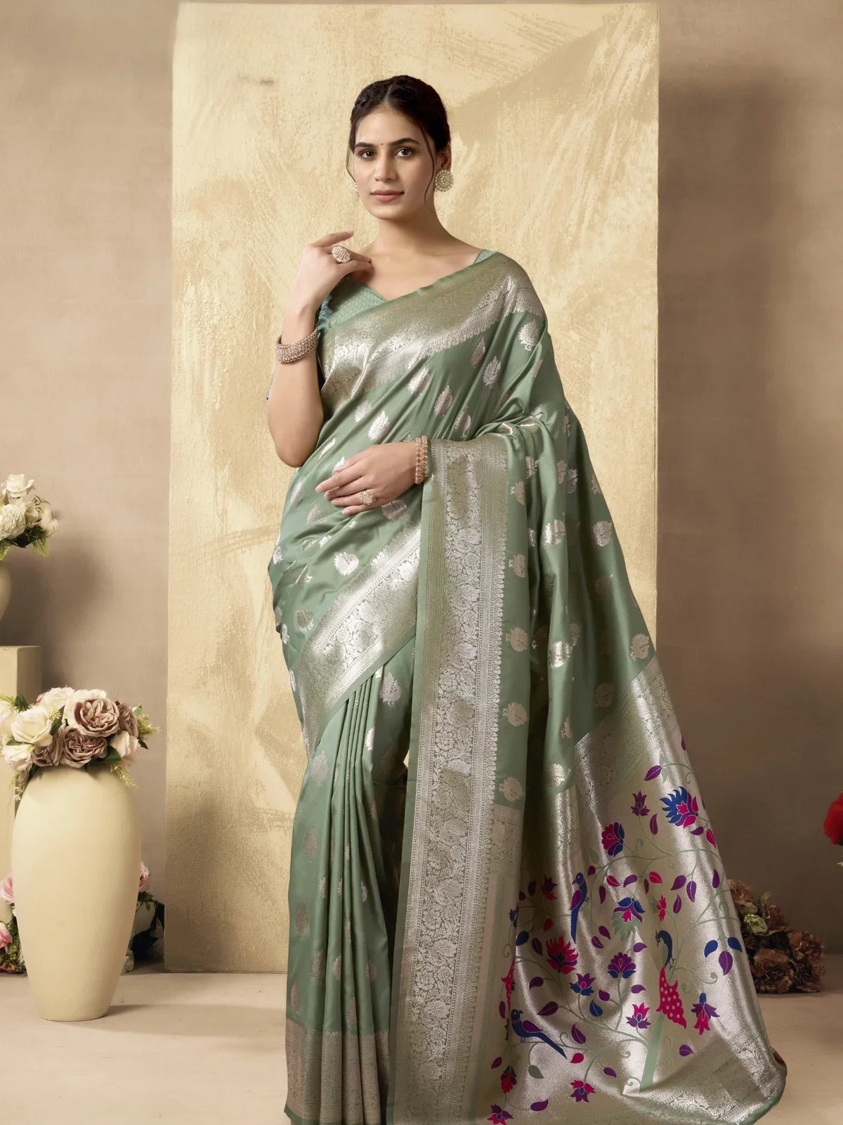 Tarani premium green silk saree with silver zari work and floral pallu full view