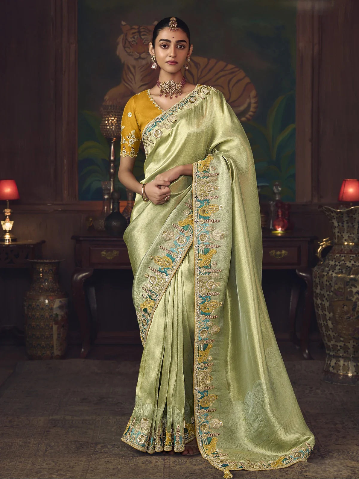 Tarani green silk saree with heavy embroidery border and mustard blouse for weddings and festivals