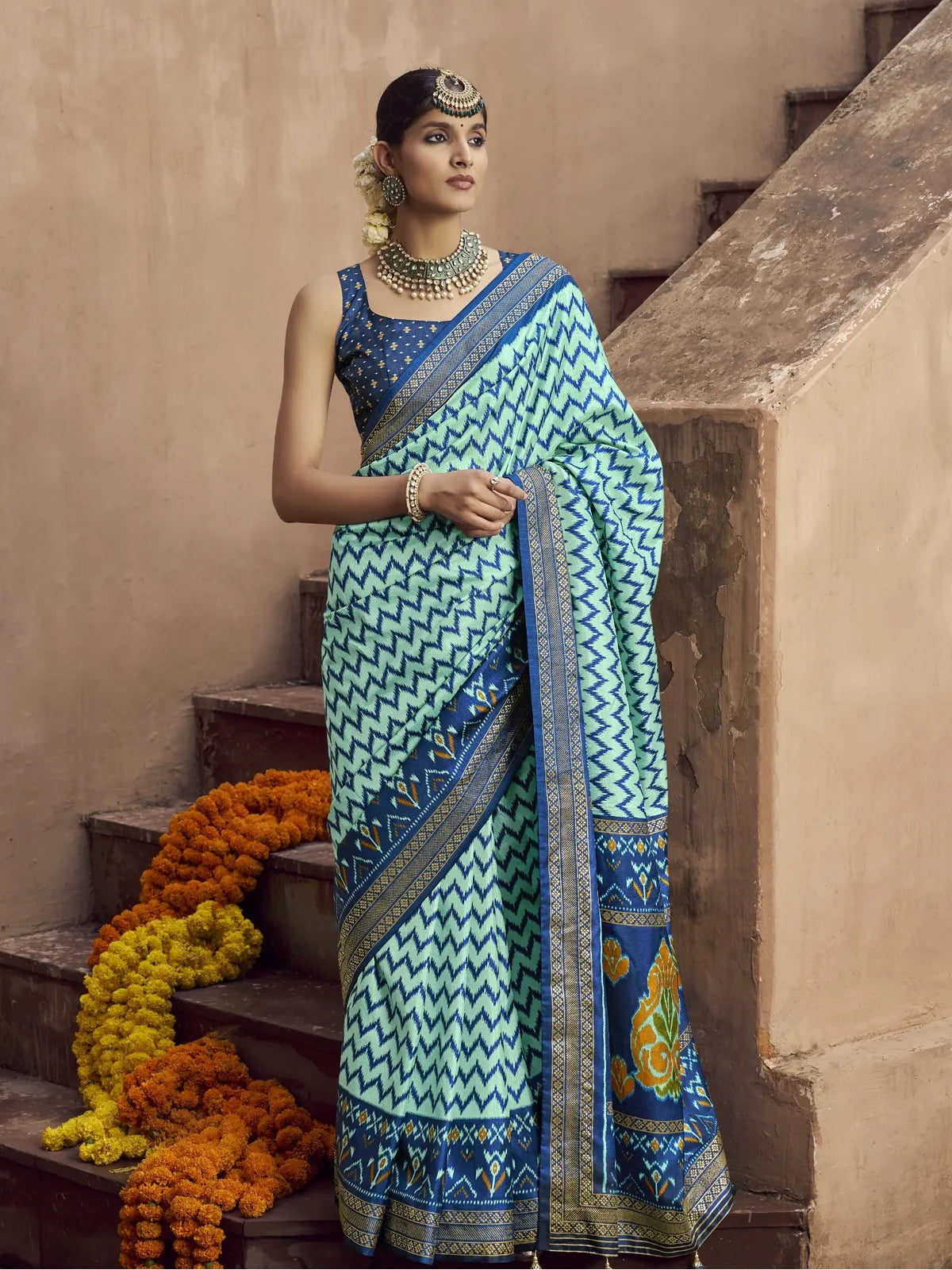 Tarani green silk saree full view with patola design and aqua finish styled with blouse