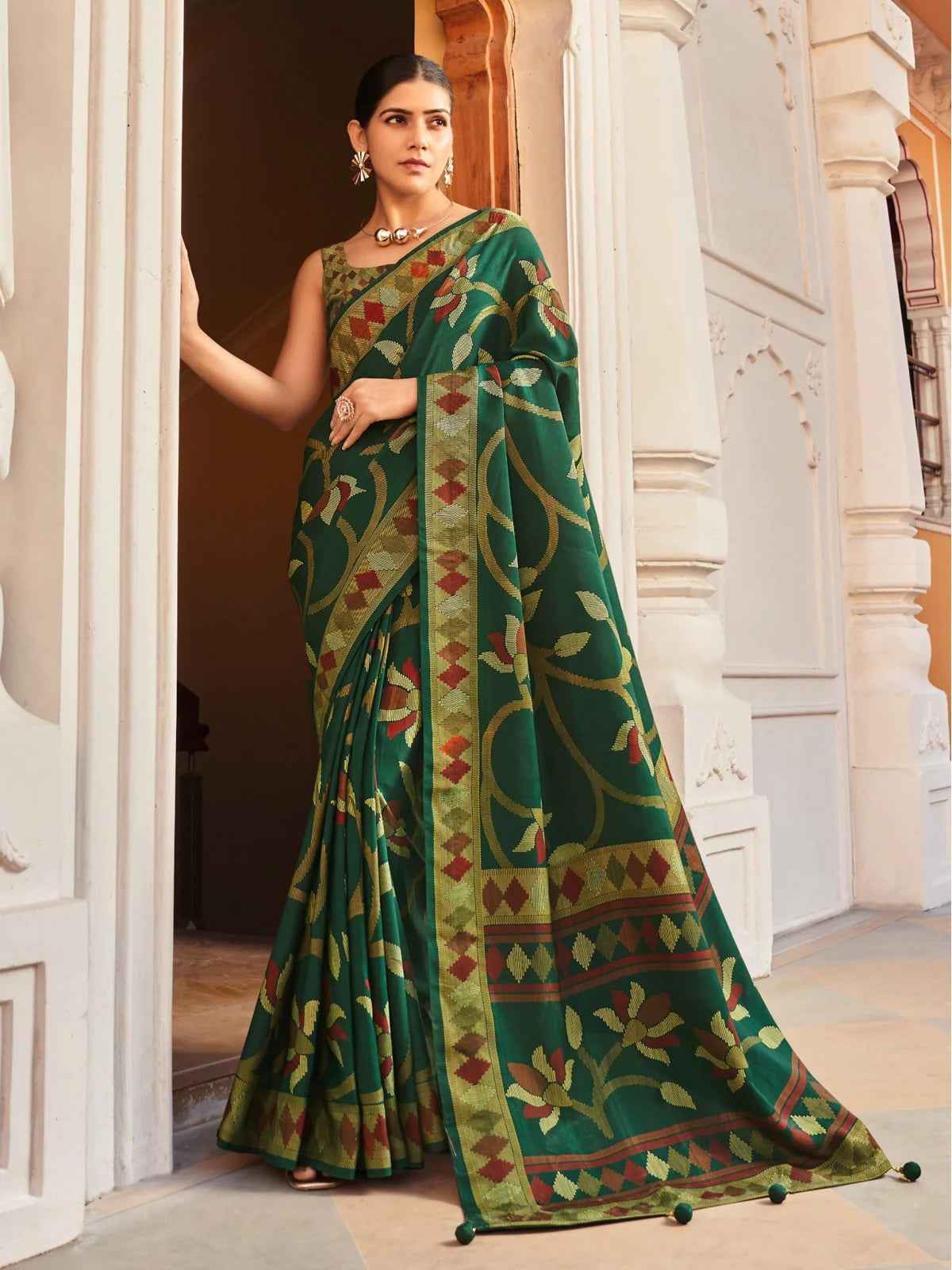 Tarani premium green silk saree with red mustard woven floral detailing and traditional border full view