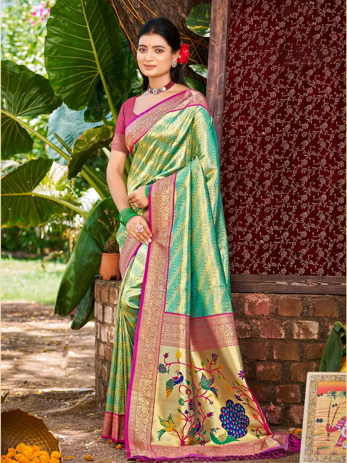 Tarani elegant green Kanjivaram silk saree full view with zari border and woven motifs