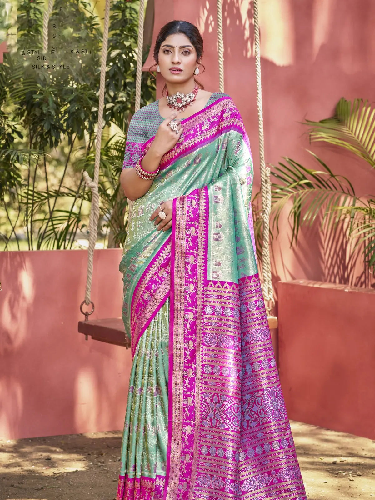 Tarani green kanjivaram silk saree full view with pink border and woven design