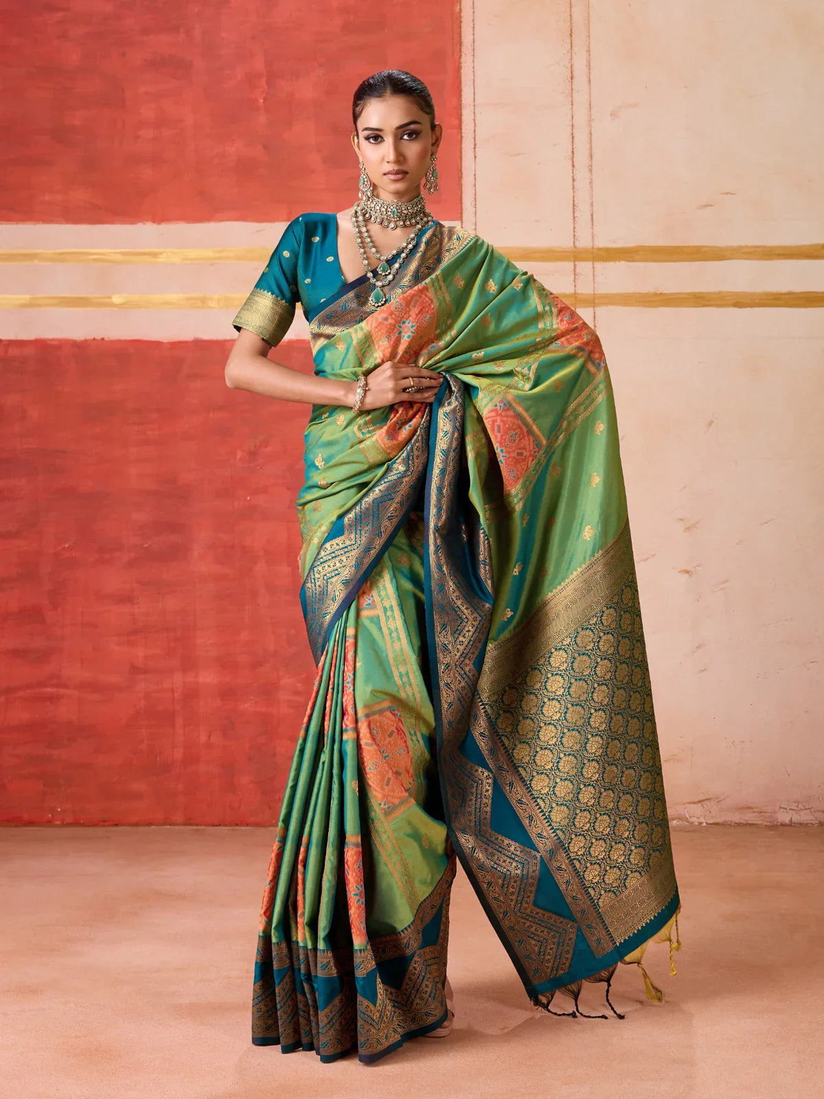 Tarani green handloom silk saree with golden pallu and intricate zari design