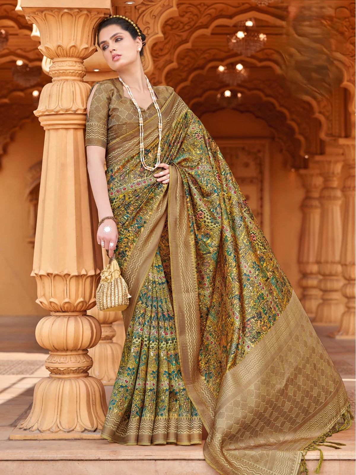 Tarani elegant green silk saree full view with intricate woven design and golden border