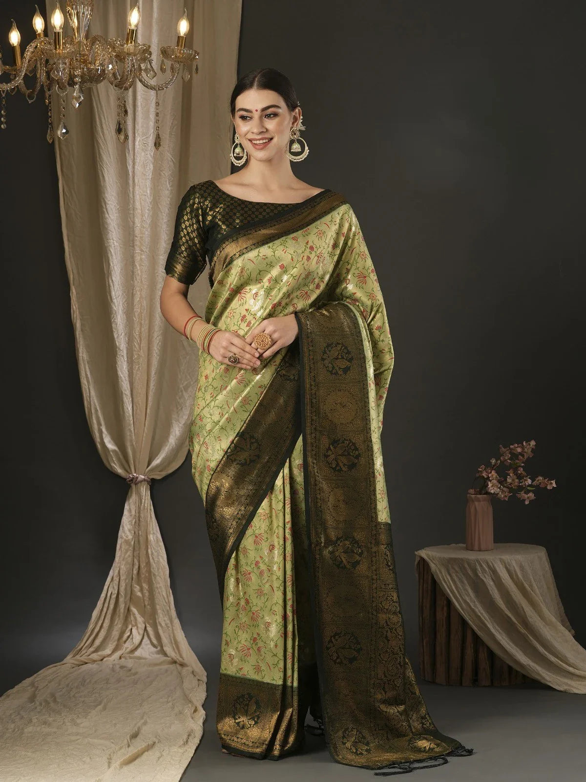 Tarani green silk saree with zari border and floral design for festive occasions