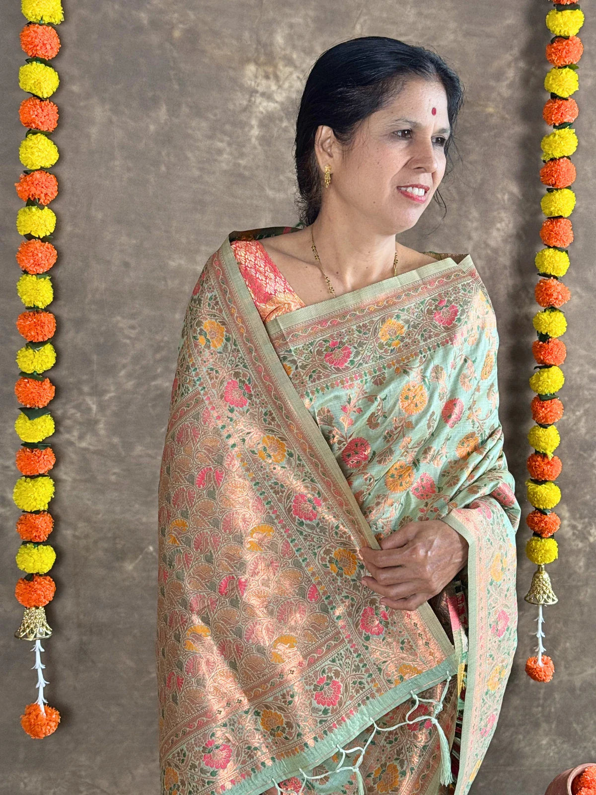 Tarani festive green woven silk saree pallu view with zari border detailing