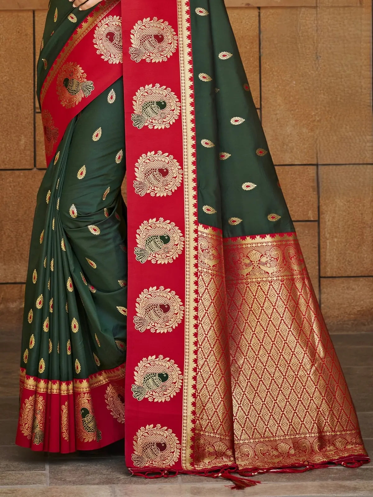 Tarani green silk saree pallu view with rich zari weaving and traditional border detailing
