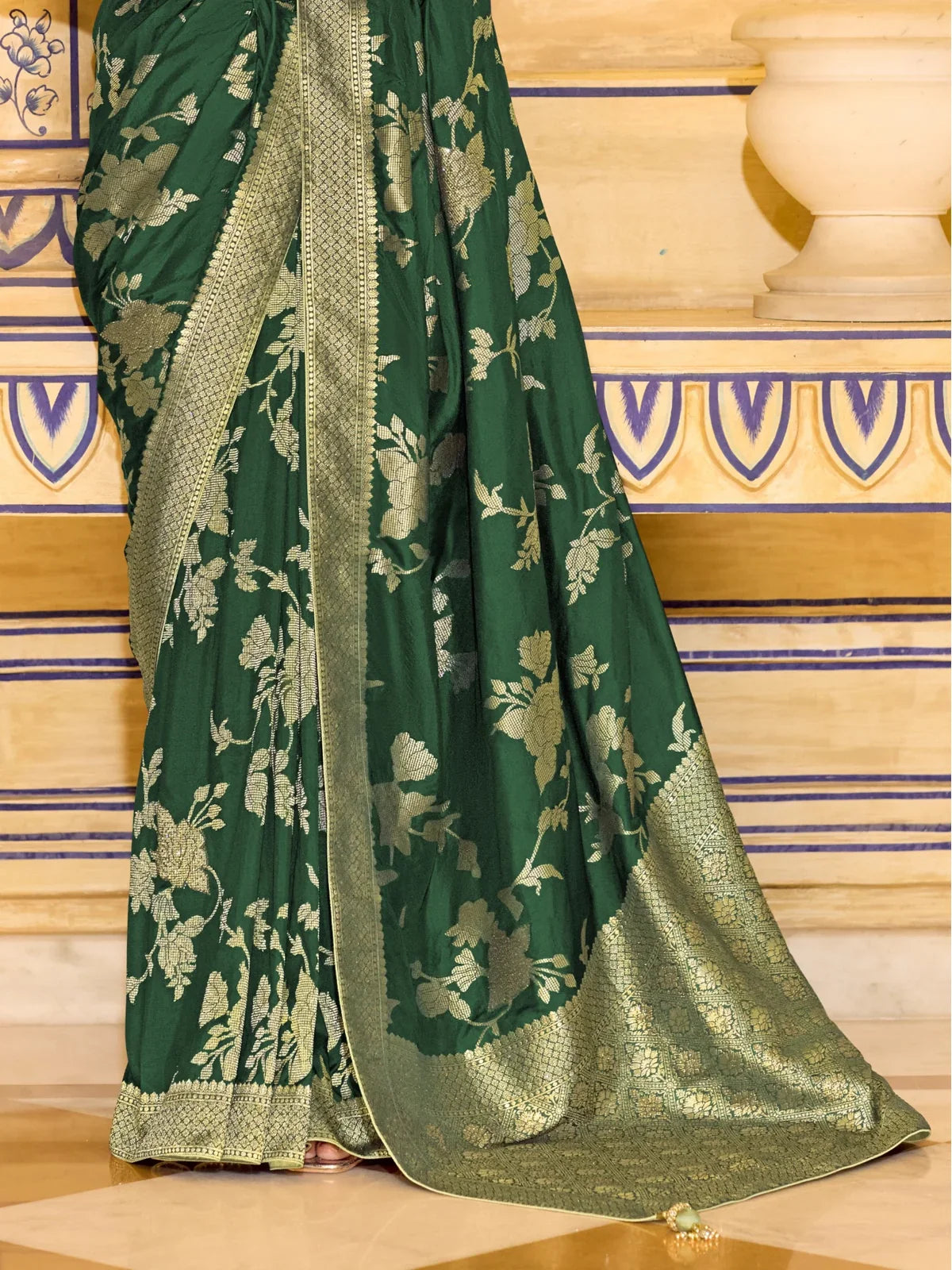 Full view of Tarani crepe silk saree in deep green with golden zari work and blouse