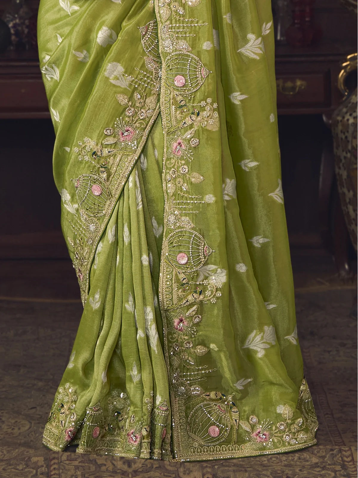Tarani green silk saree pallu embroidery closeup with floral detailing