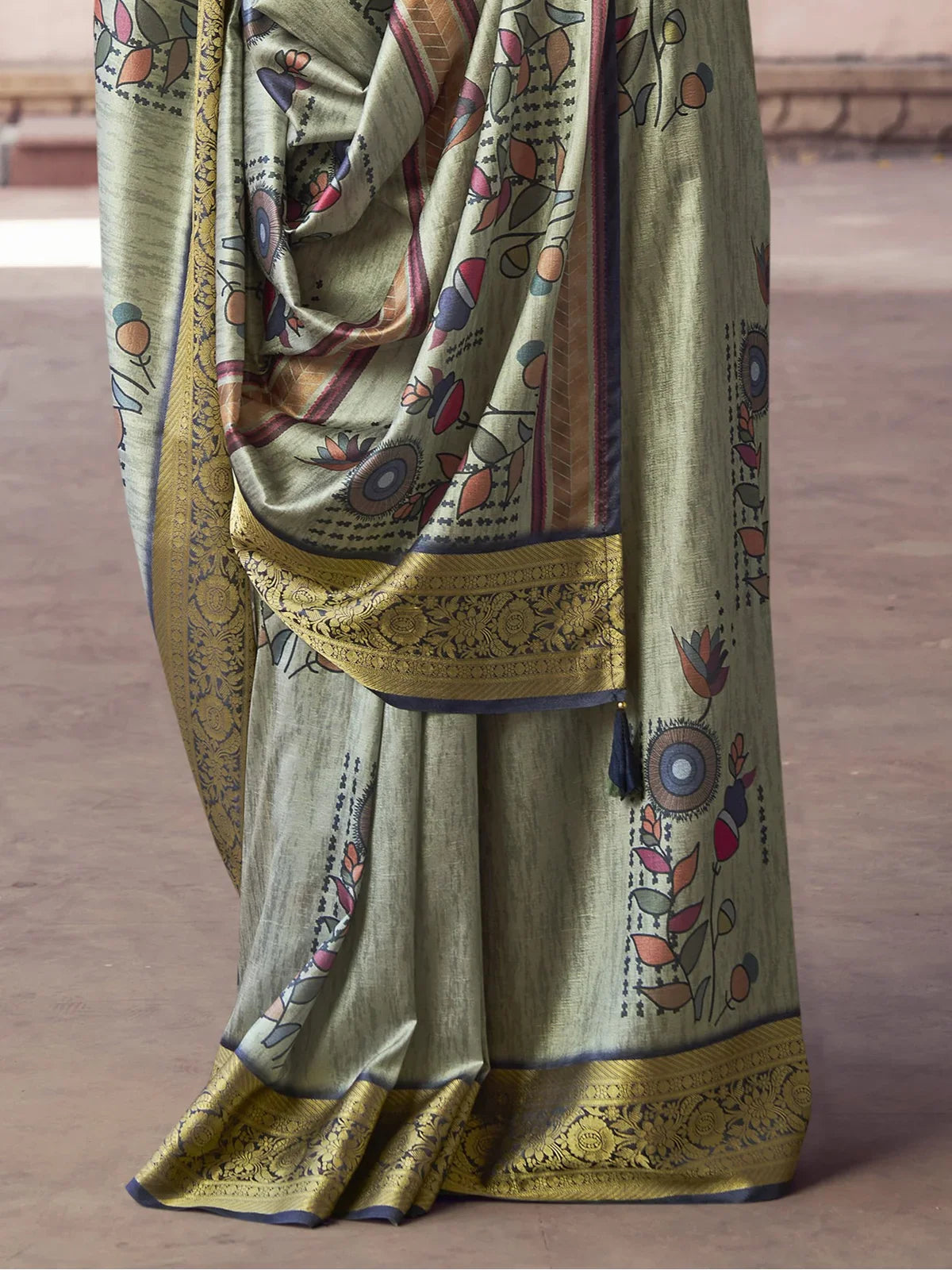 Tarani green silk saree pallu and border close view with embroidery tassels