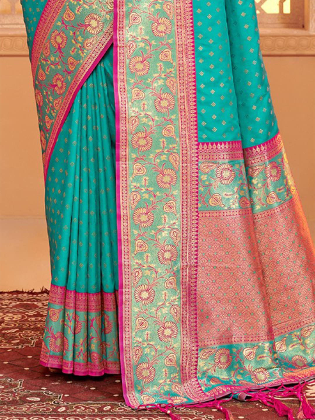 Tarani green silk saree pallu view showing intricate weaving contrast border design