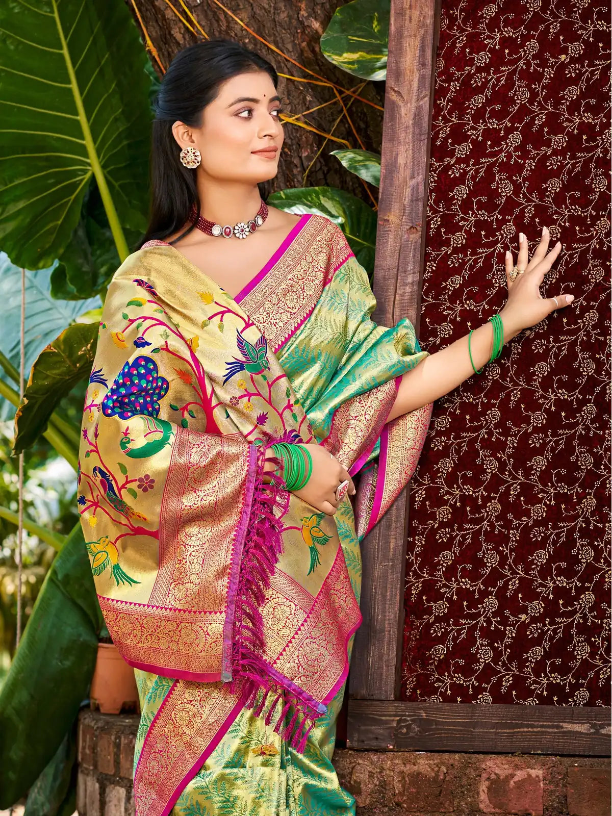 Tarani green Kanjivaram silk saree pallu with peacock and floral designs in vibrant hues