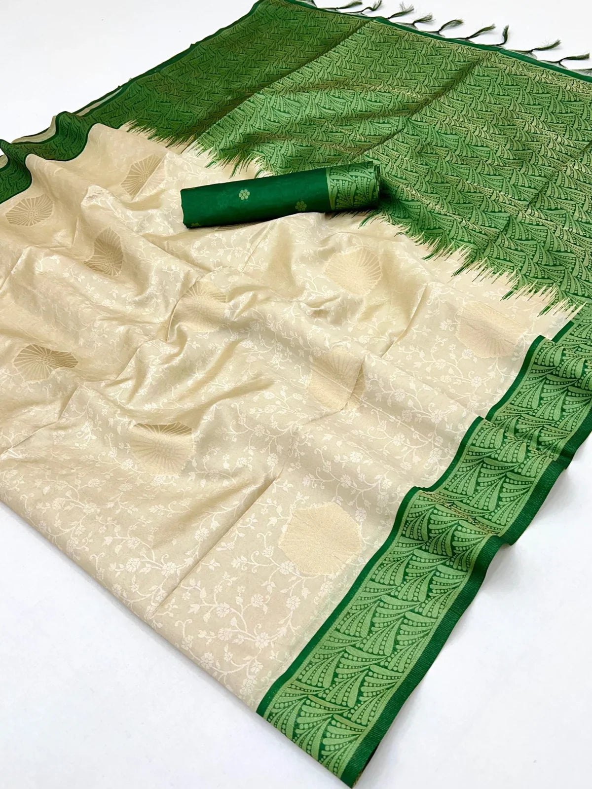 Tarani pallu view of handloom paper silk saree with lush green detailing and traditional finish