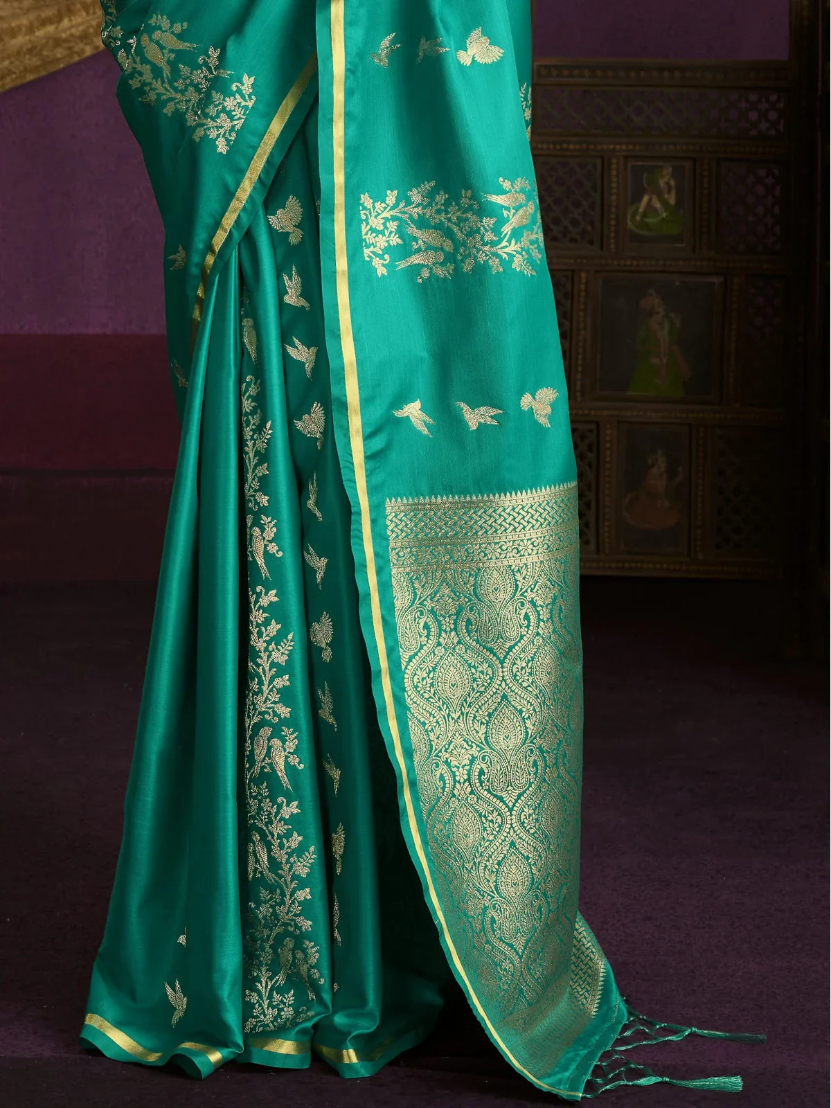 Tarani green silk saree pallu with golden woven work and elegant zari border in pallu view