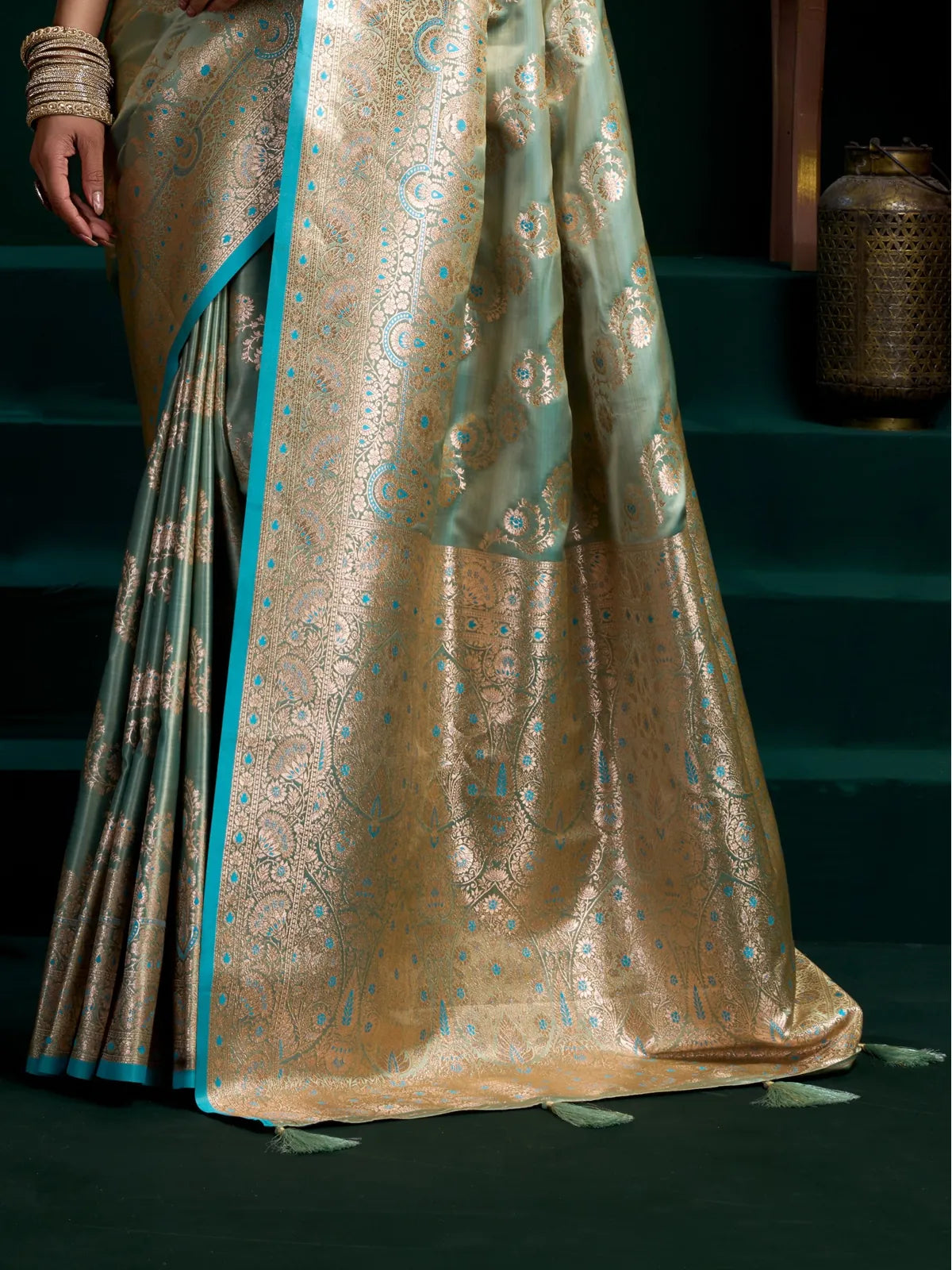 Tarani premium green satin silk saree with elegant zari pallu and intricate detailing