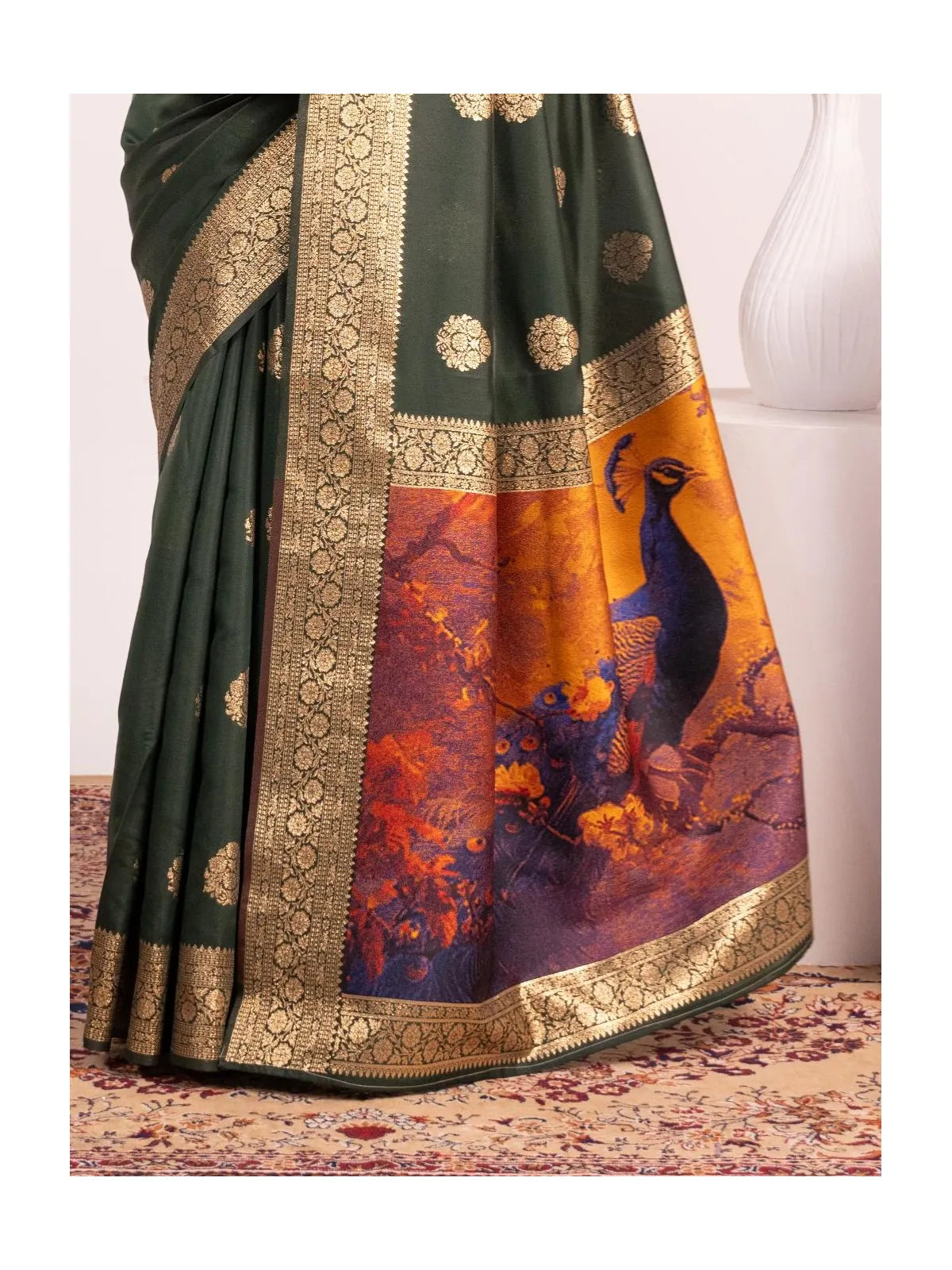 Tarani banarasi saree in green with artistic resham peacock pallu in orange and purple shades