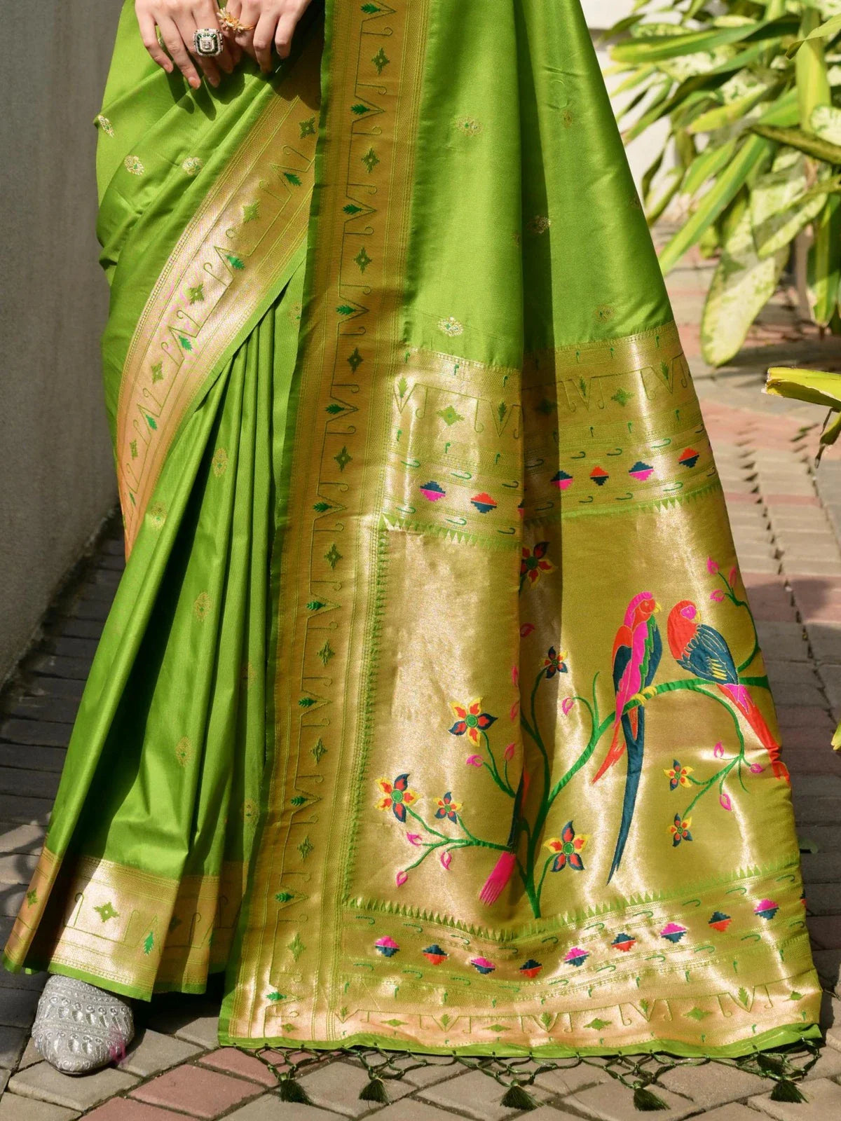 Tarani rich zari woven pallu with colorful birds and flowers in green paithani saree