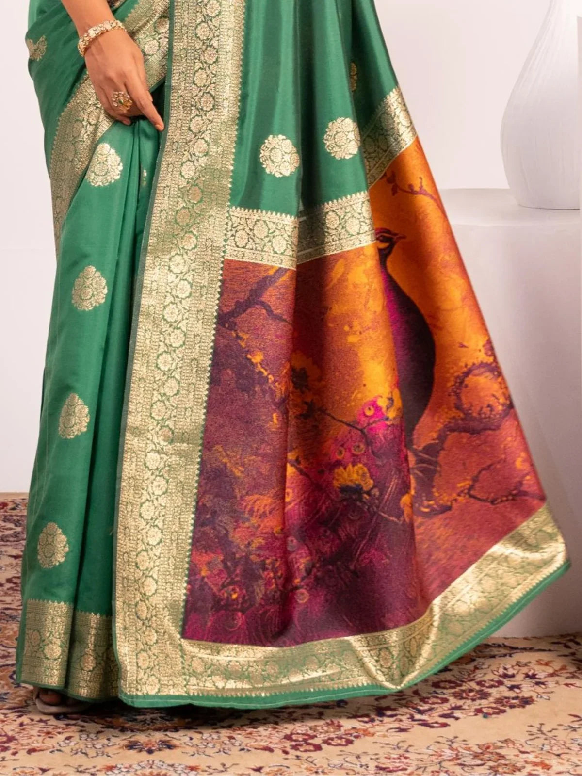 Tarani green saree with rich resham peacock pallu and zari border design close-up