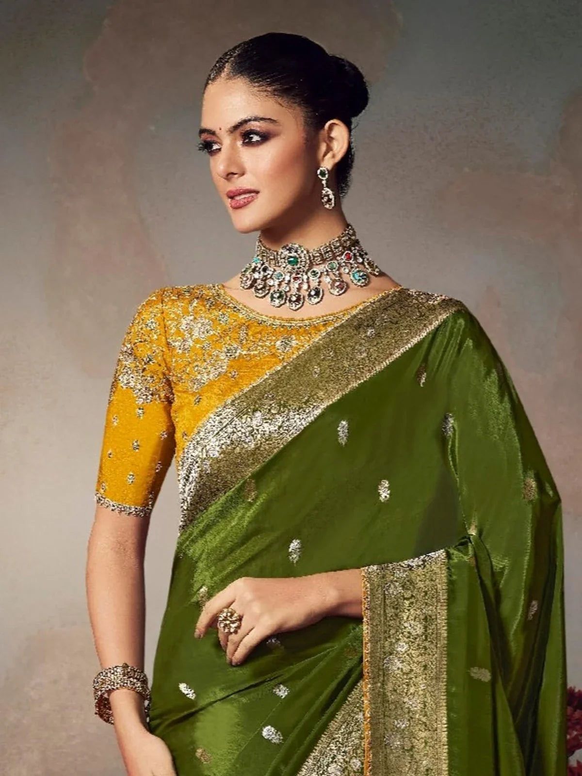 Tarani pallu closeup of green silk saree with zari work and detailed border