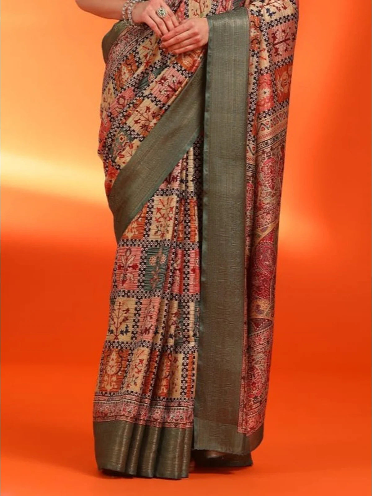 Tarani green silk saree pallu view showcasing woven design and border