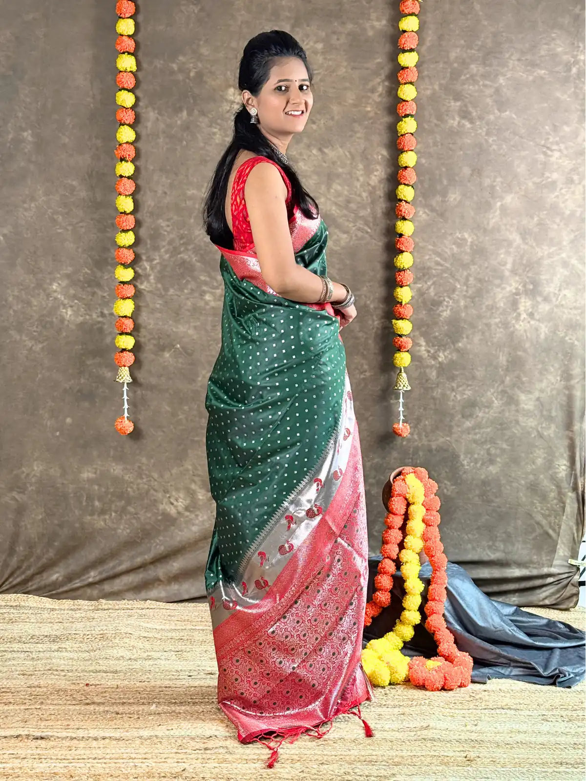 Tarani green silk saree side view highlighting traditional woven design