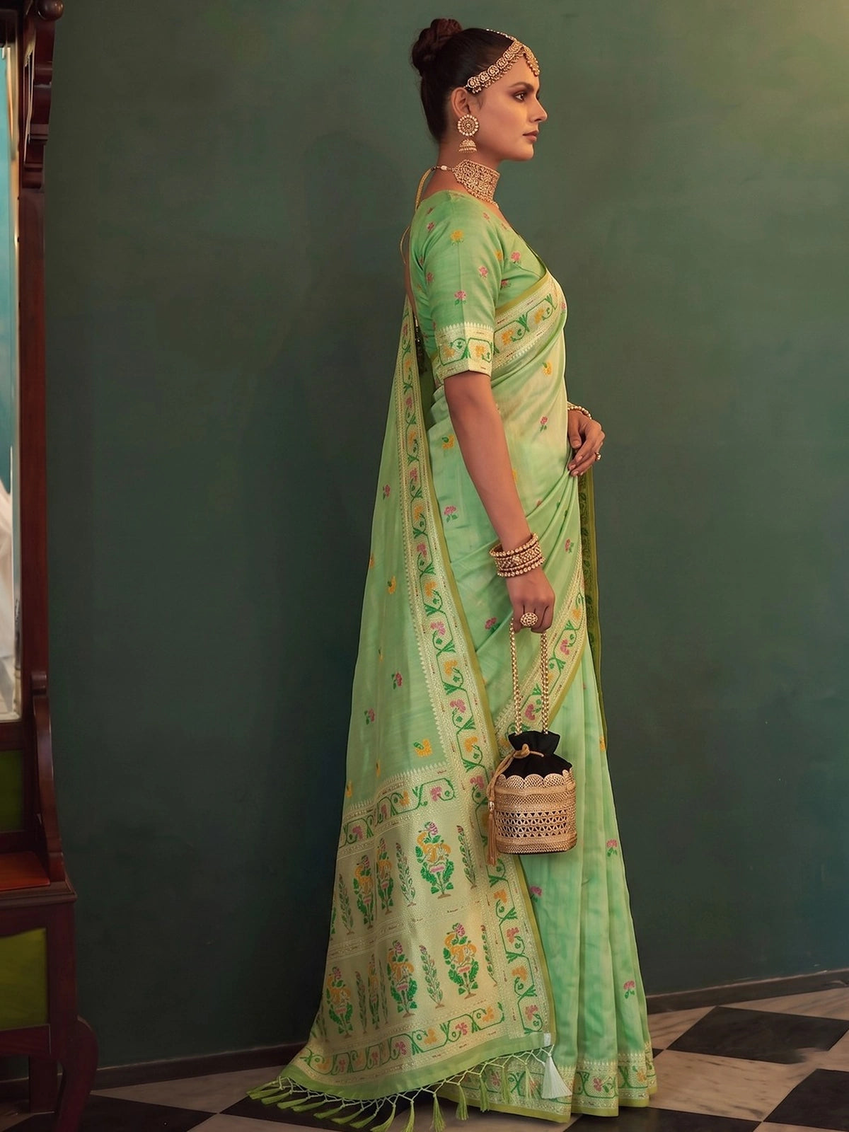 Tarani Kamalika green tissue silk saree with weaving blouse and designer border side view