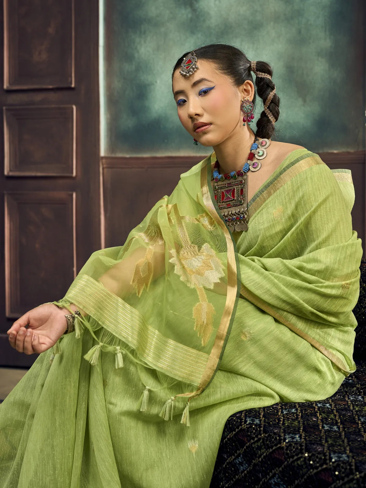 Tarani pure Munga silk handloom green saree side-view with woven pallu and blouse