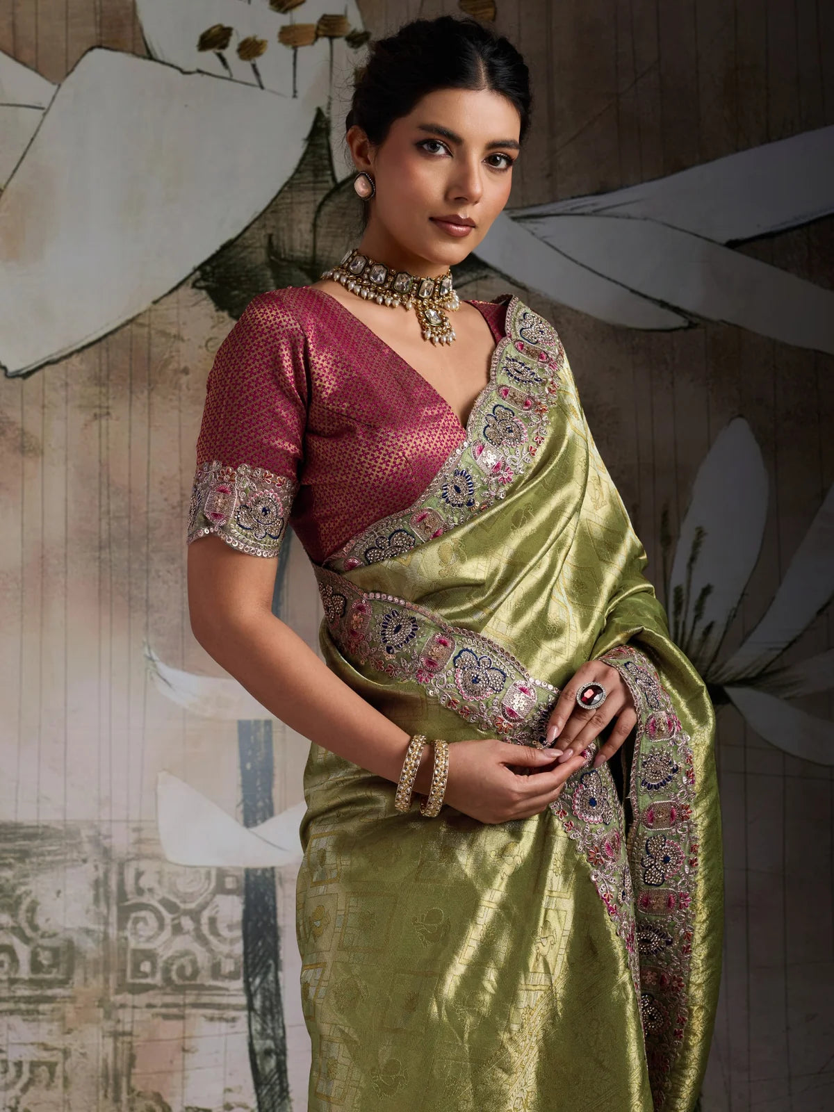 Tarani olive green Banarasi jacquard silk saree upper body view showing blouse and border embroidery