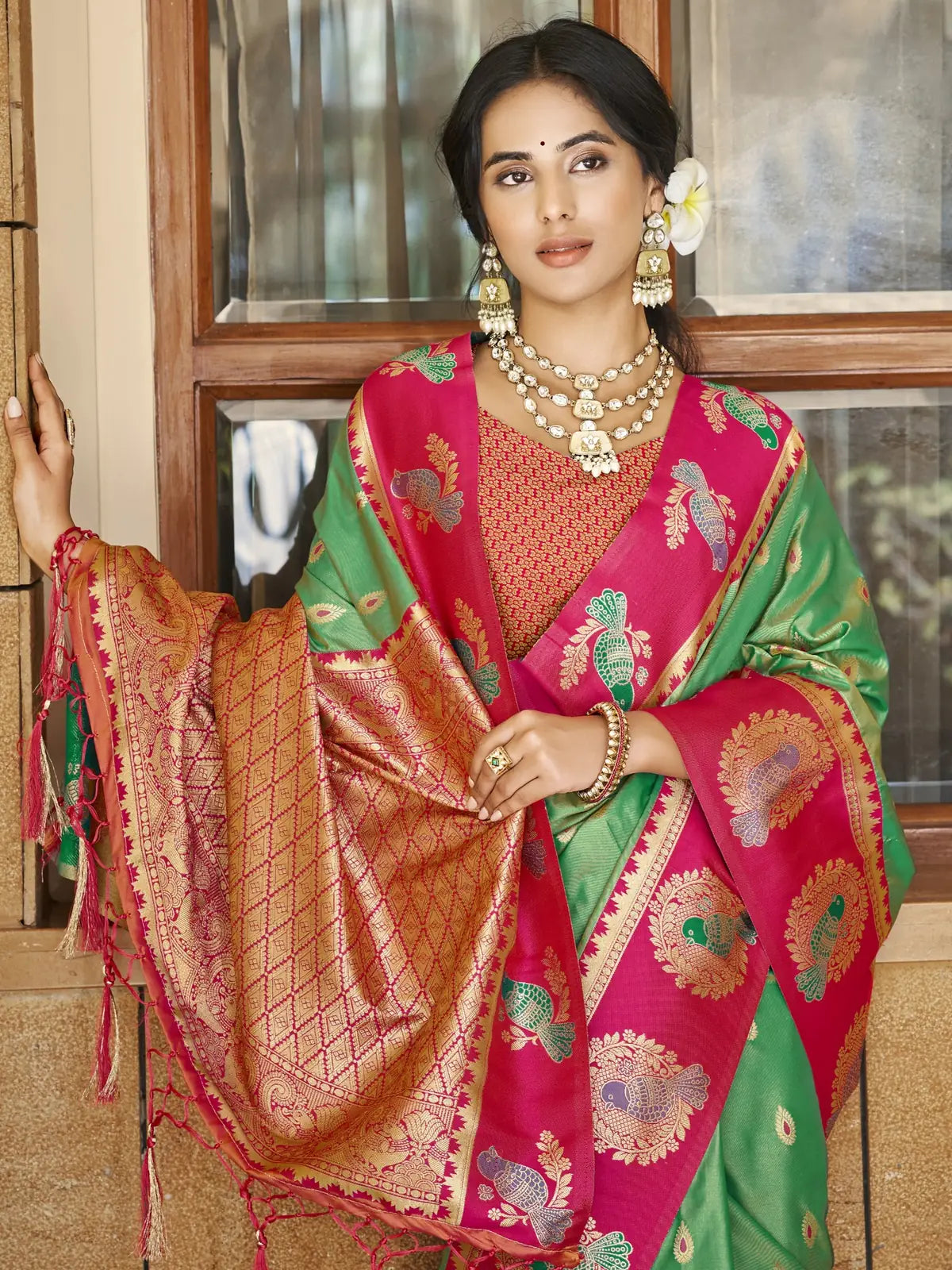 Tarani green silk saree upper body view with zari weaving blouse and rich woven pallu