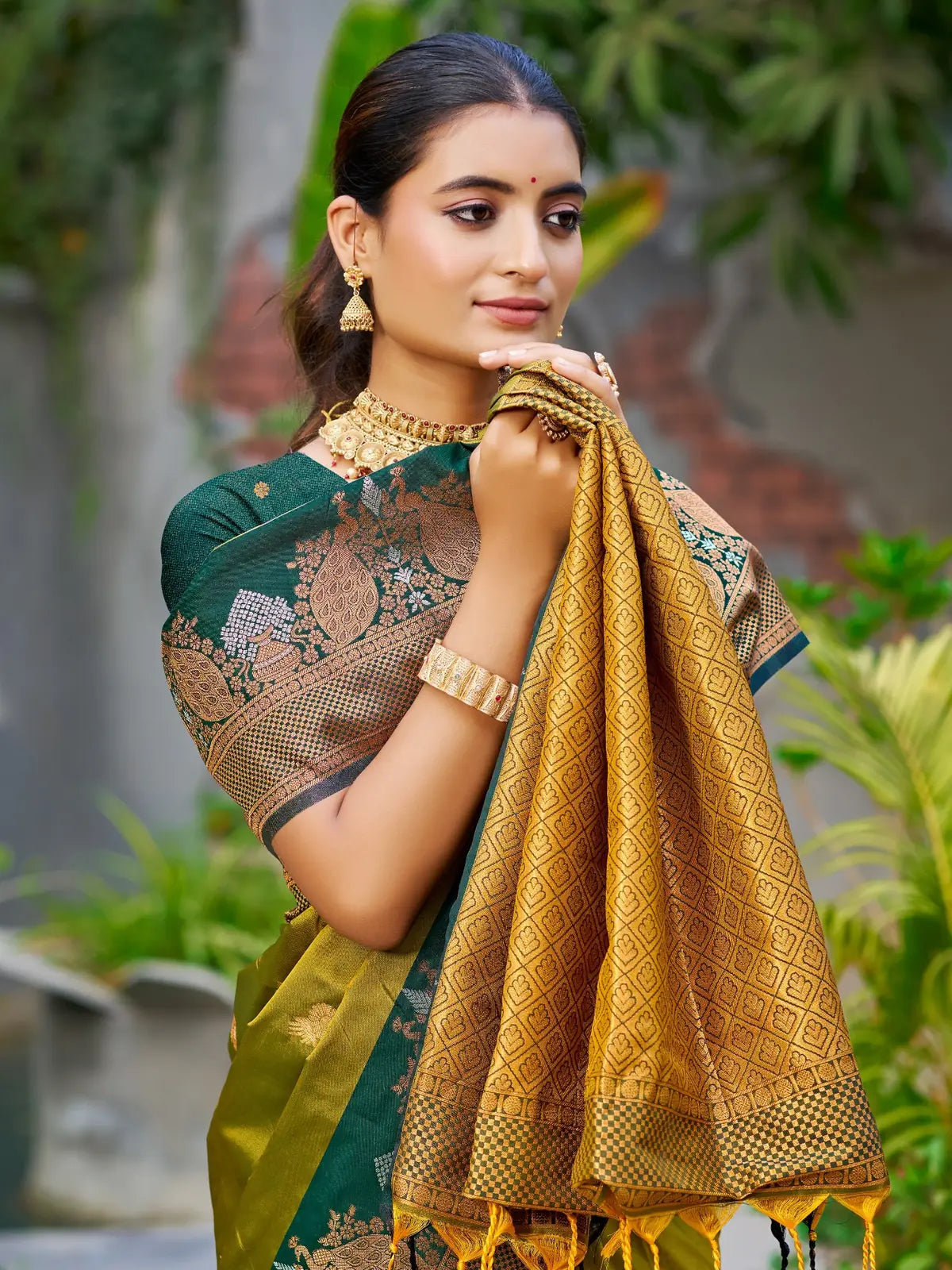 Tarani green soft silk saree upper body view with woven zari pallu and contrast blouse