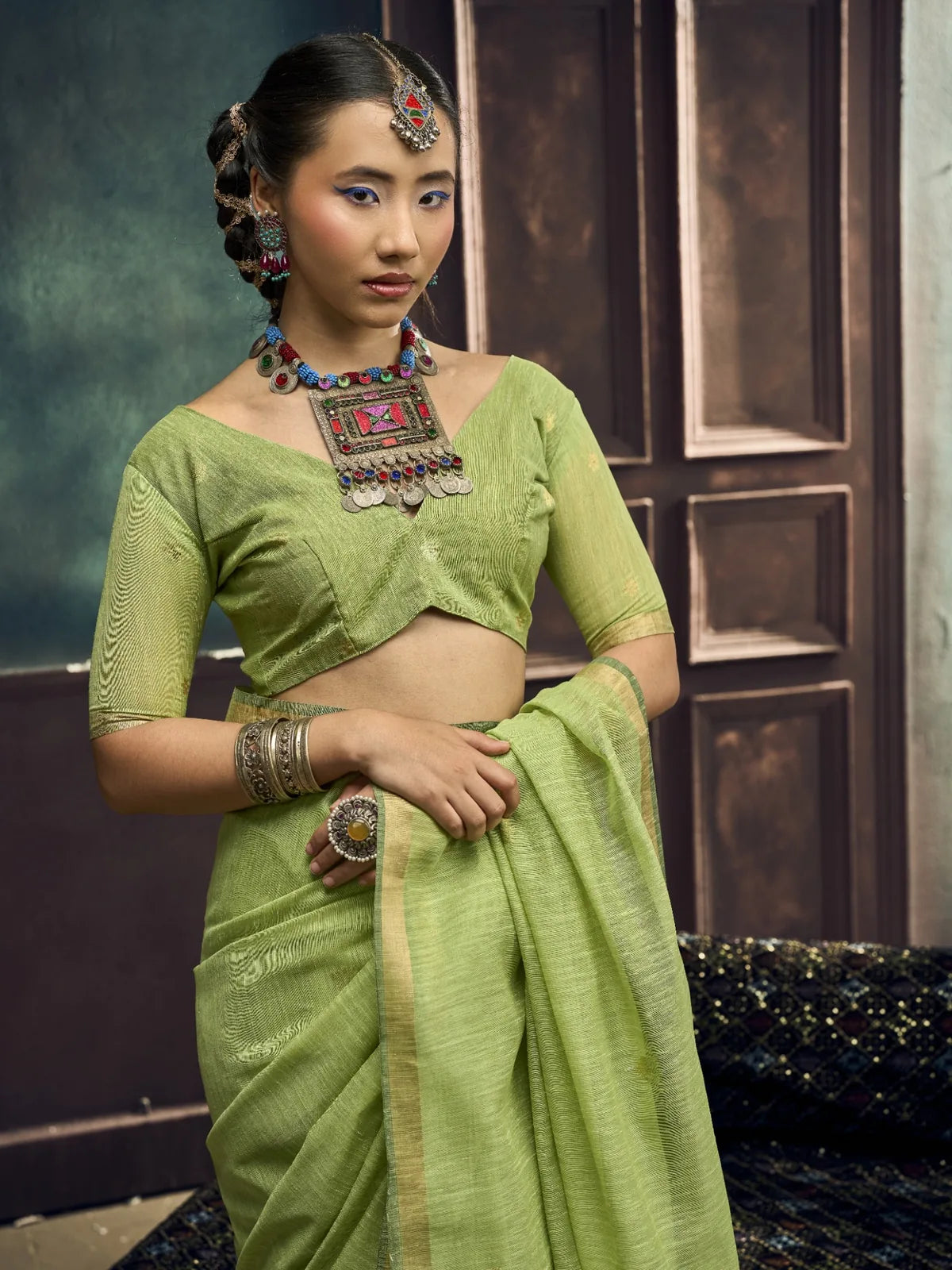 Tarani pure Munga silk handloom green saree upper-body-view with woven pallu and blouse